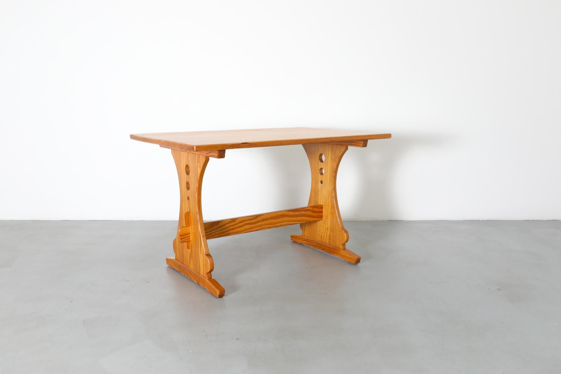 20th Century Mid-Century Gilbert Marklund Inspired Pine Table with Ornate Trestle Base For Sale