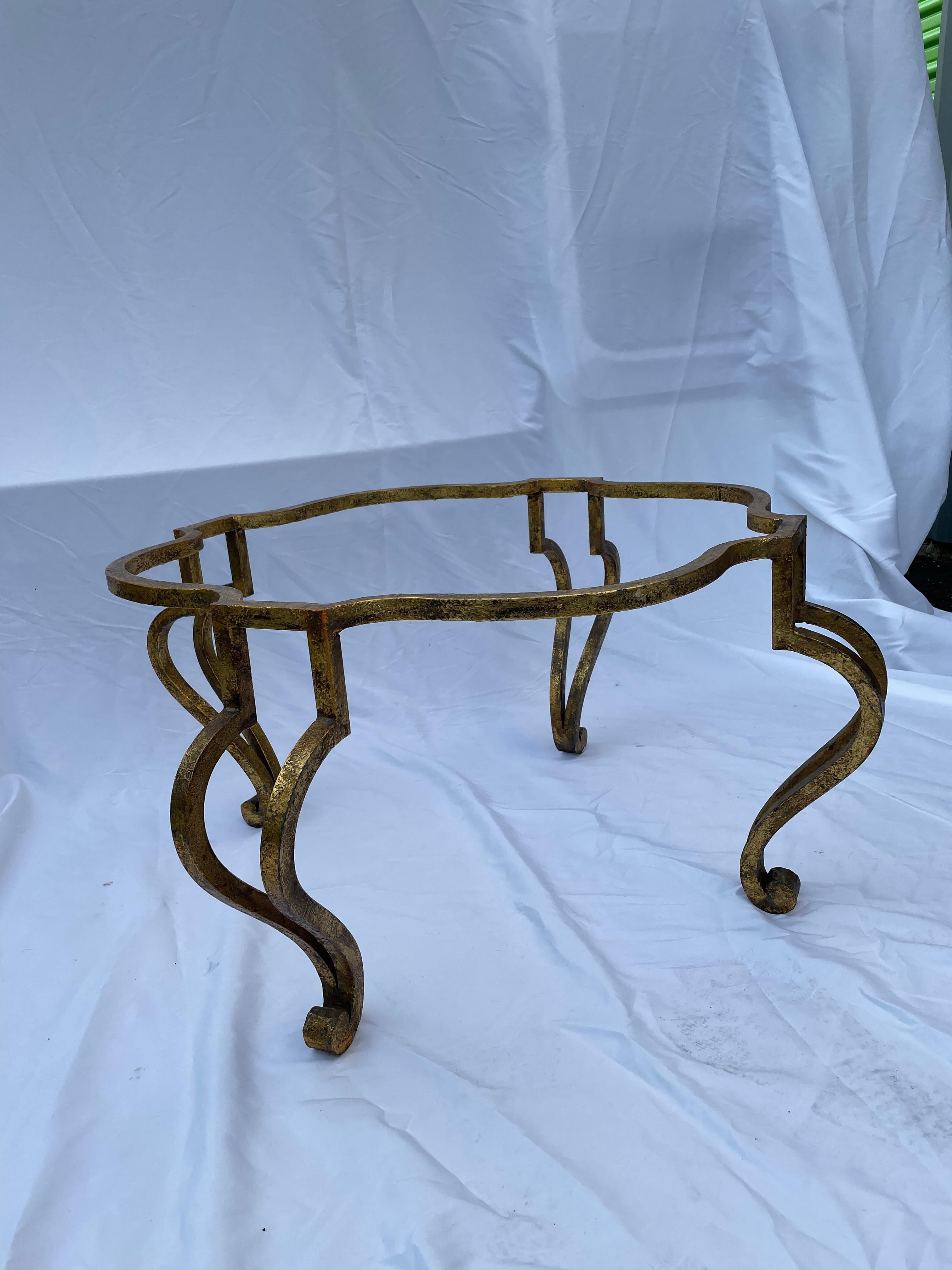 1950's -60's coffee table in gilded bronze and scroll legs with uniquely shaped thick glass top, French.