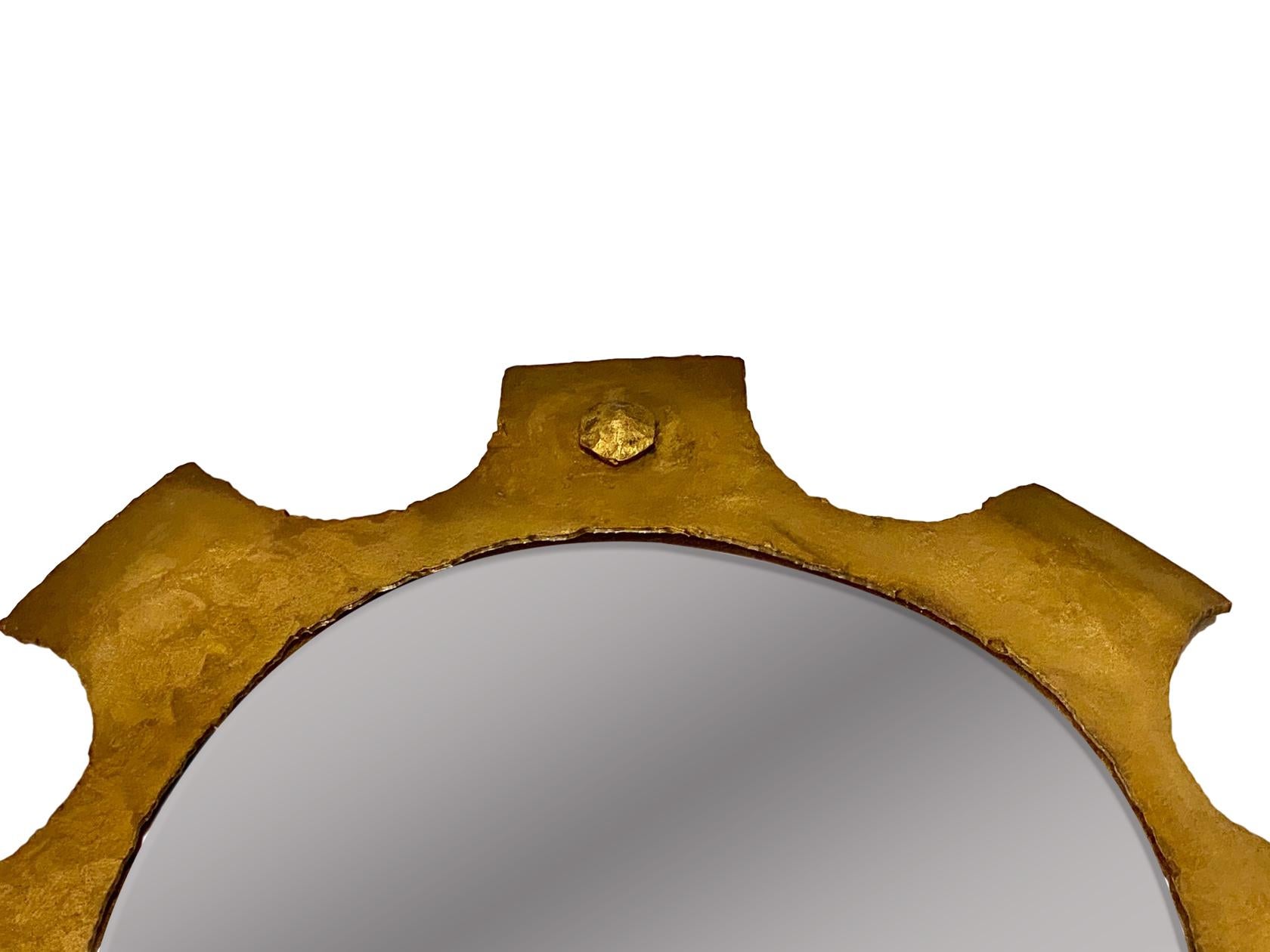 A circa 1960s Italian gilt iron Brutalist style mirror.

Measurements:
Diameter 23.5?
Depth 1?.