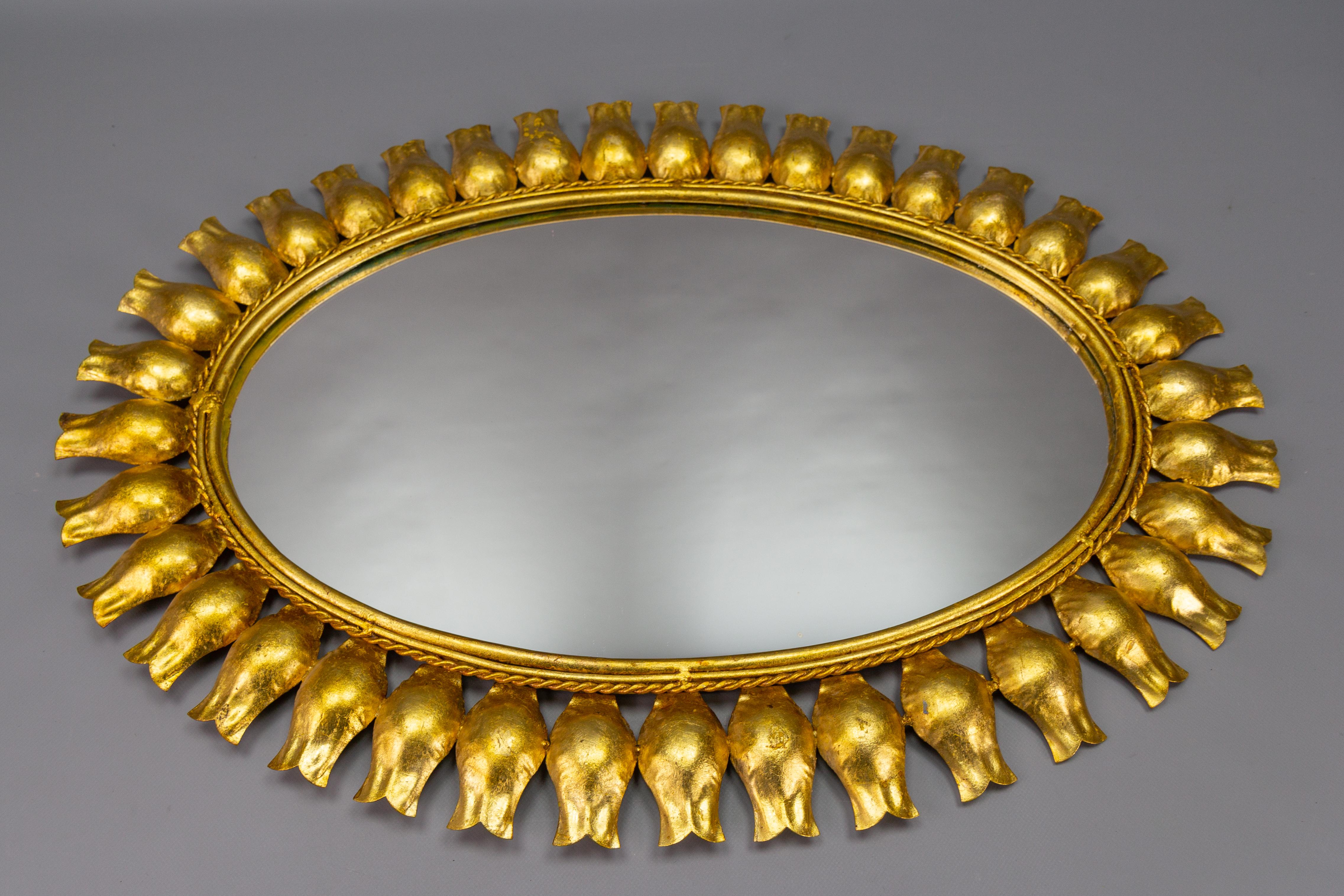 German Mid-Century Gilt Metal Oval Sunburst Wall Mirror For Sale