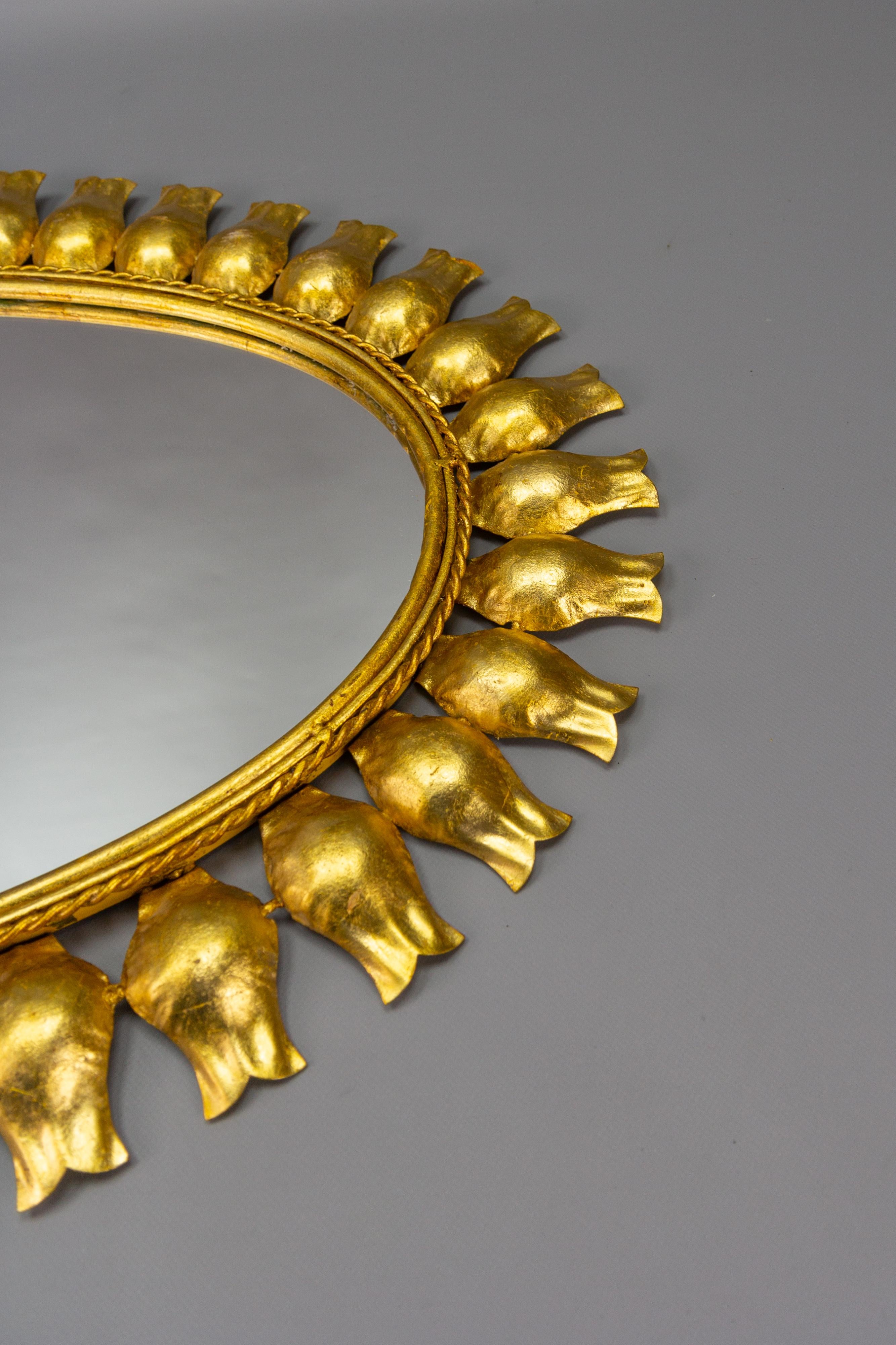 Mid-Century Gilt Metal Oval Sunburst Wall Mirror For Sale 1