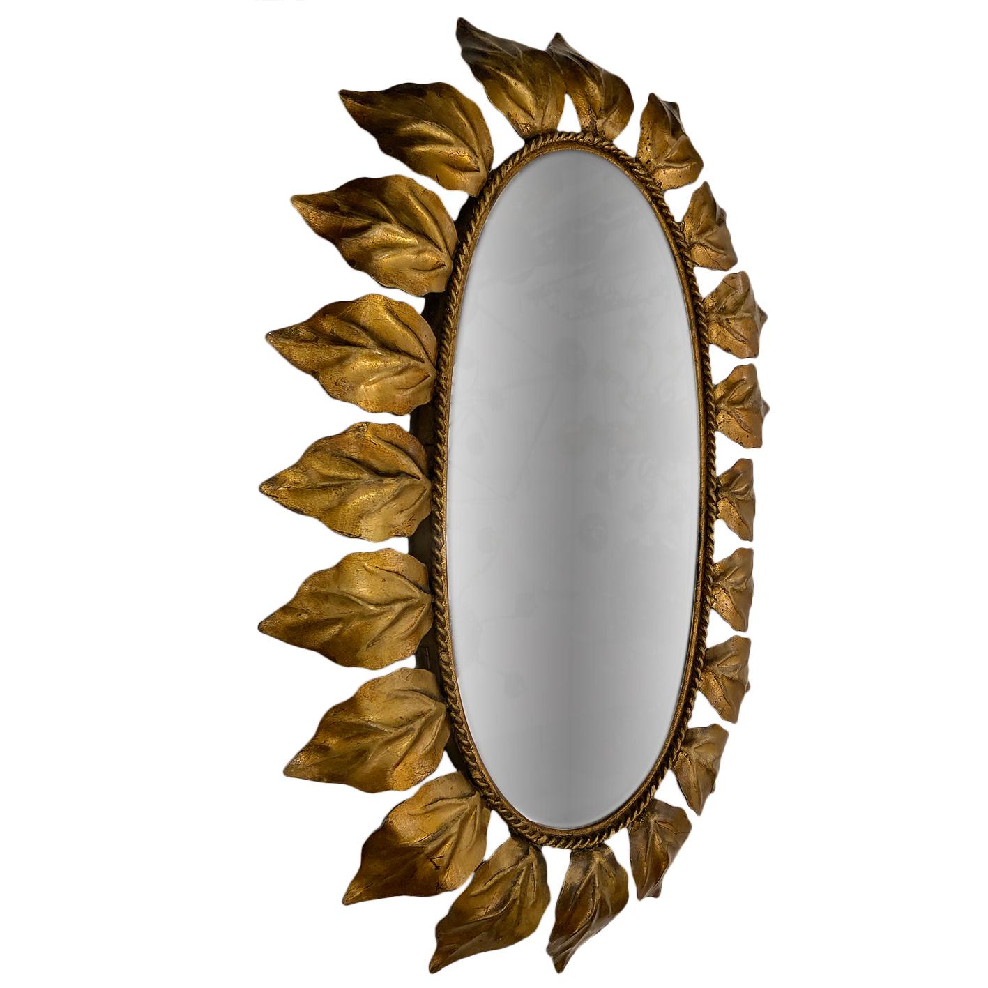 A circa 1950's Italian gilt metal sunburst mirror with original patina.

Measurements:
Height: 22