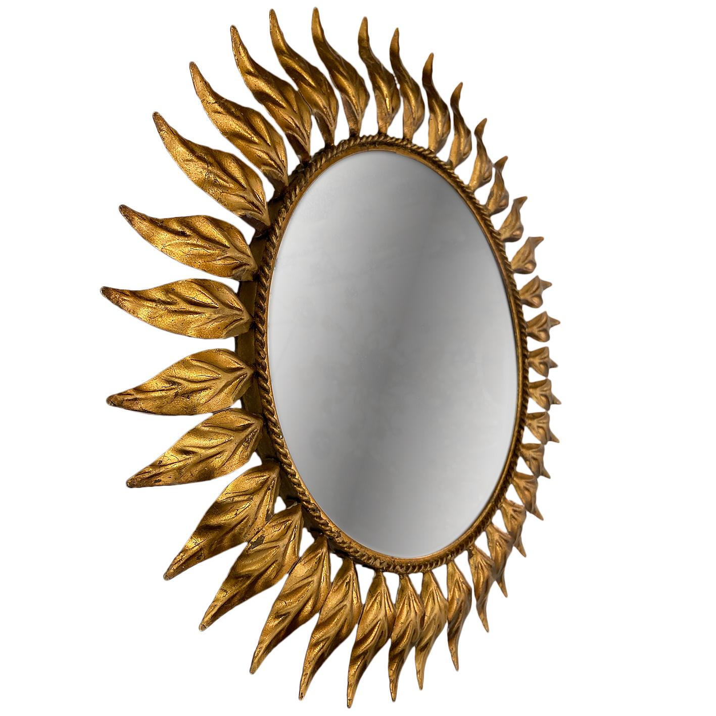 A circa 1950s Italian gilt metal sunburst mirror with original patina.

Measurements:
Diameter 18.25