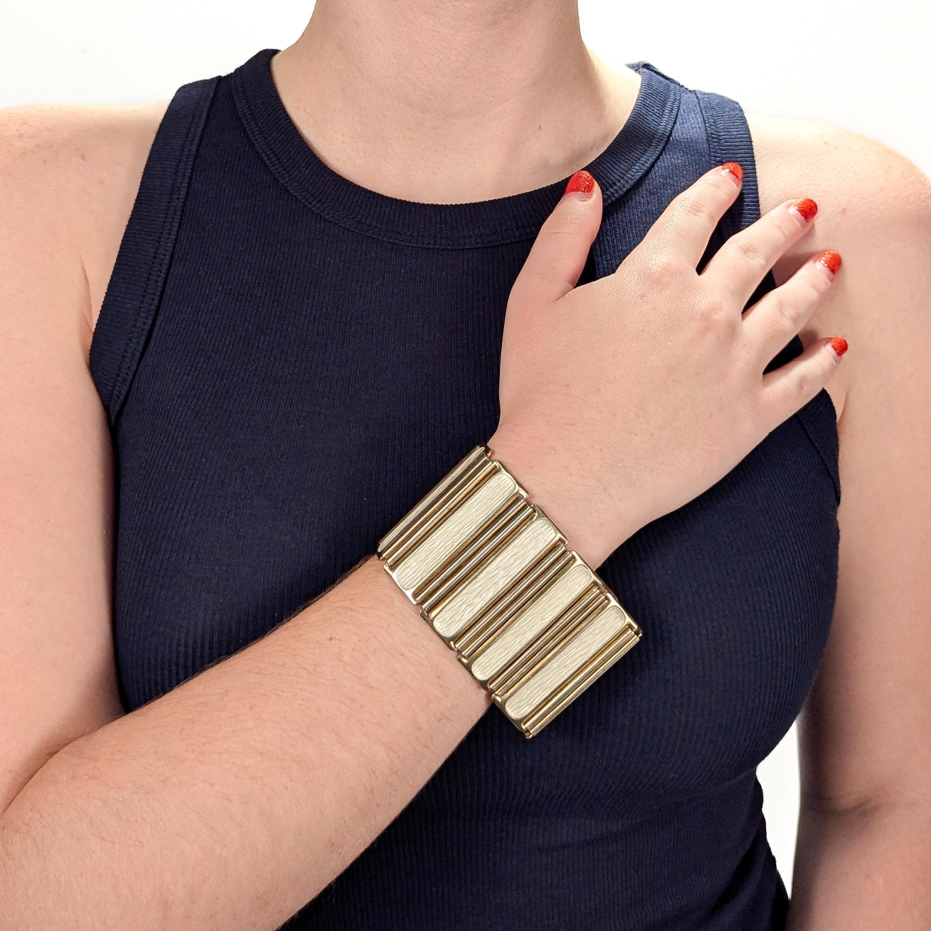 A fine, signed and documented Norwegian mid-century bracelet.

Designed by Grete Prytz Kittelsen for J. Tostrup.

In gilt sterling silver and white enamel.

Comprised rectangular links with oval white enamel panels joined by narrow figure eight