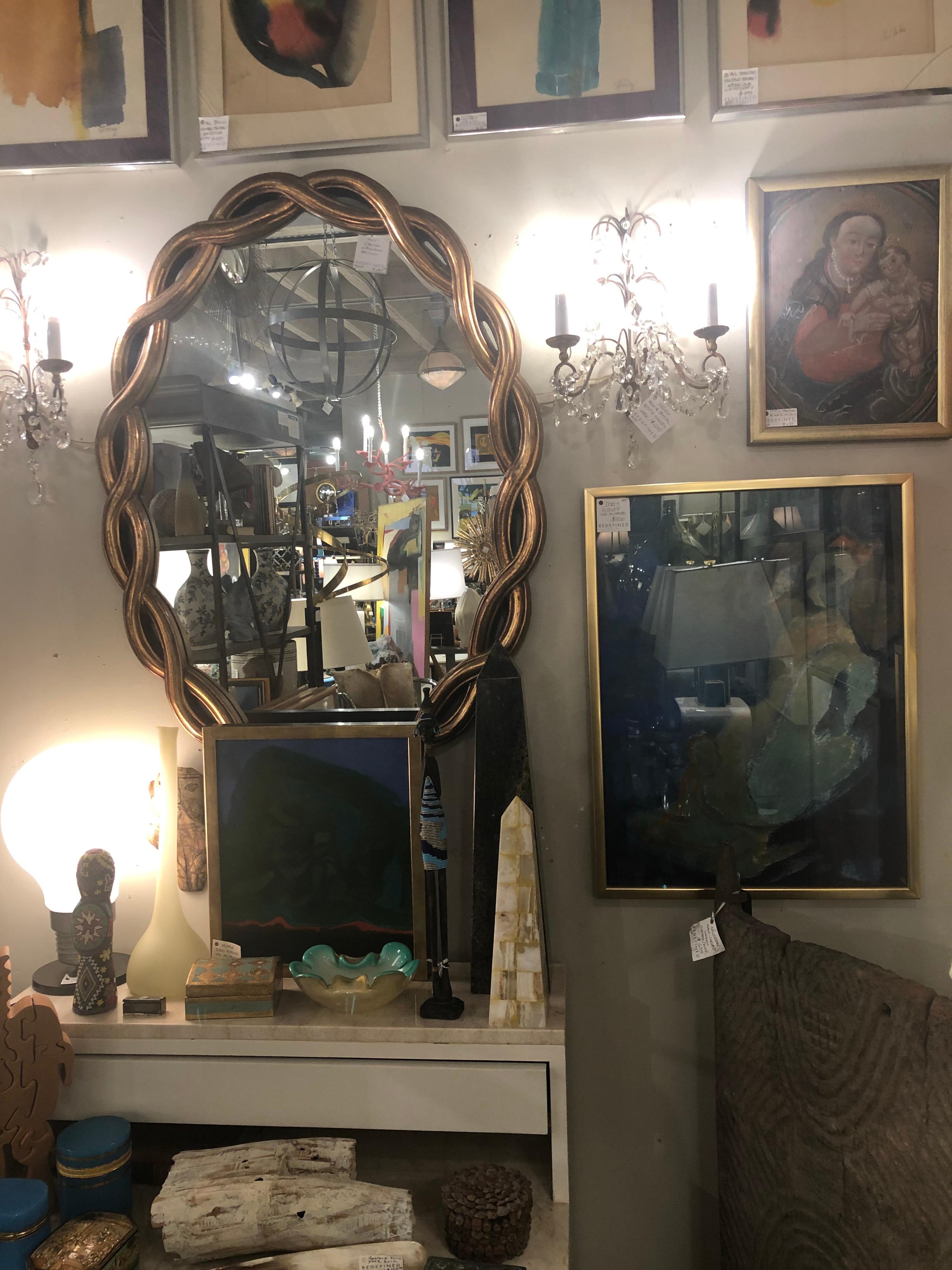 A mid Twentieth century gilt wood mirror imported from Italy.