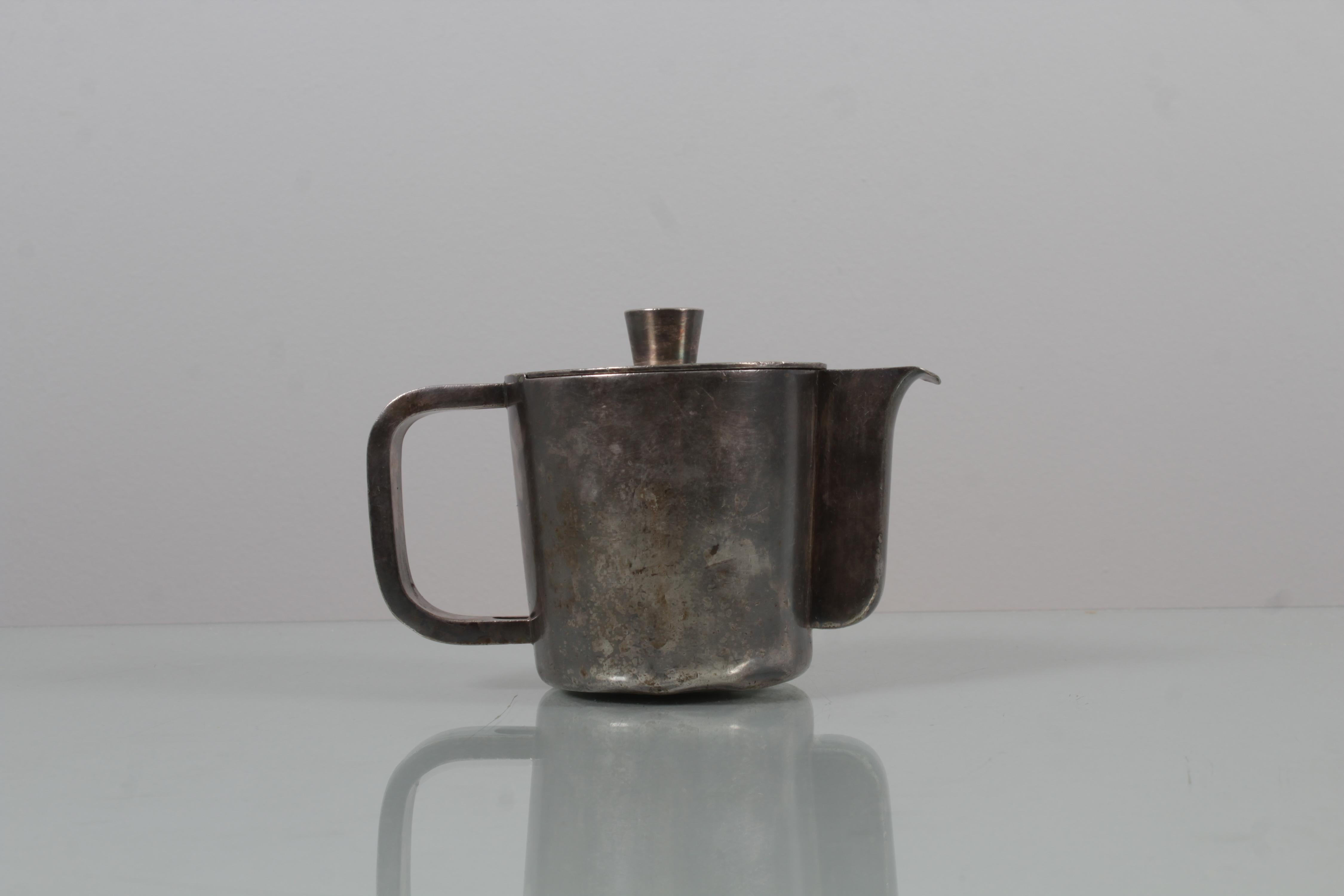 Prestigious teapot for Gran Hotel breakfast set, in nickel silver, design by Gio Ponti, 1938, produced by Krupp Milano. Some dents and natural signs of use and age on the surface. On the bottom engraved the trademark with the wording 