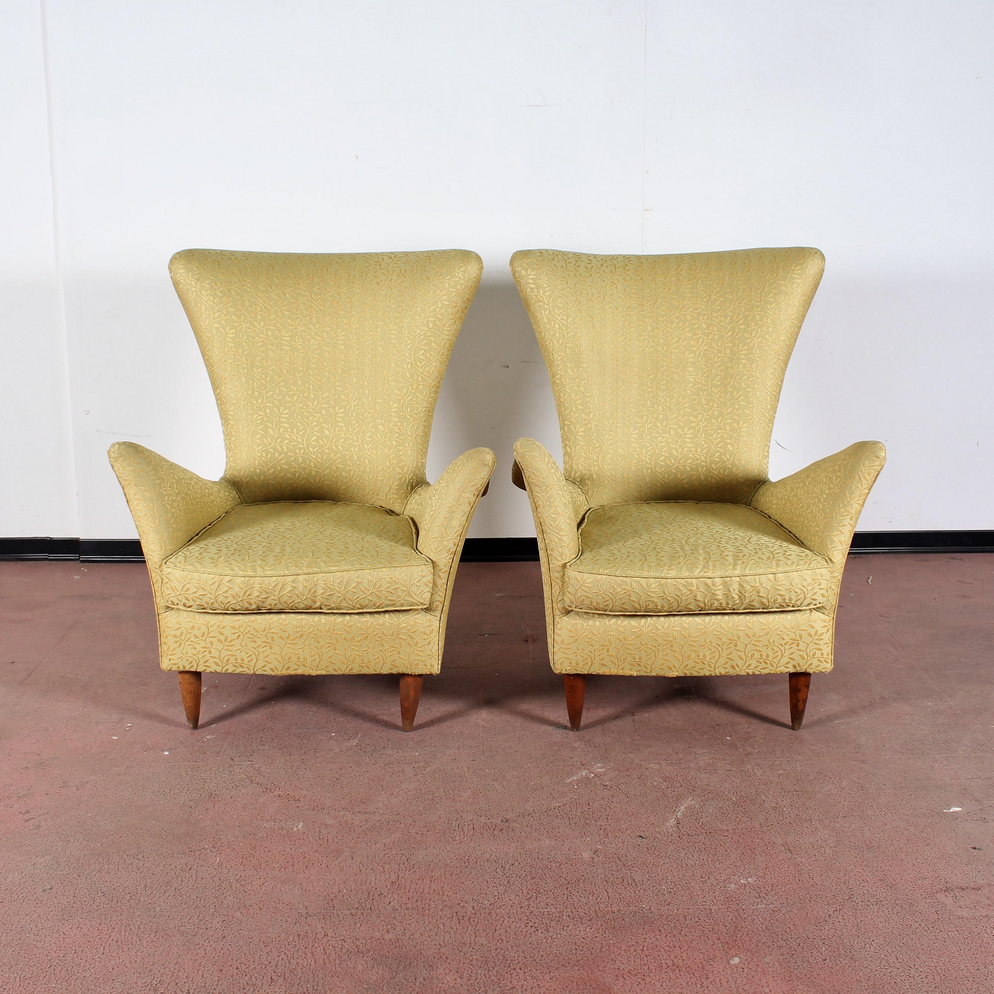 Set of two armchairs with wooden structure, gold yellow fabric covering with foliage motifs, and conical feet. Gio Ponti style, Italian manufacture in 1950s
Wear consistent with age and use.
 