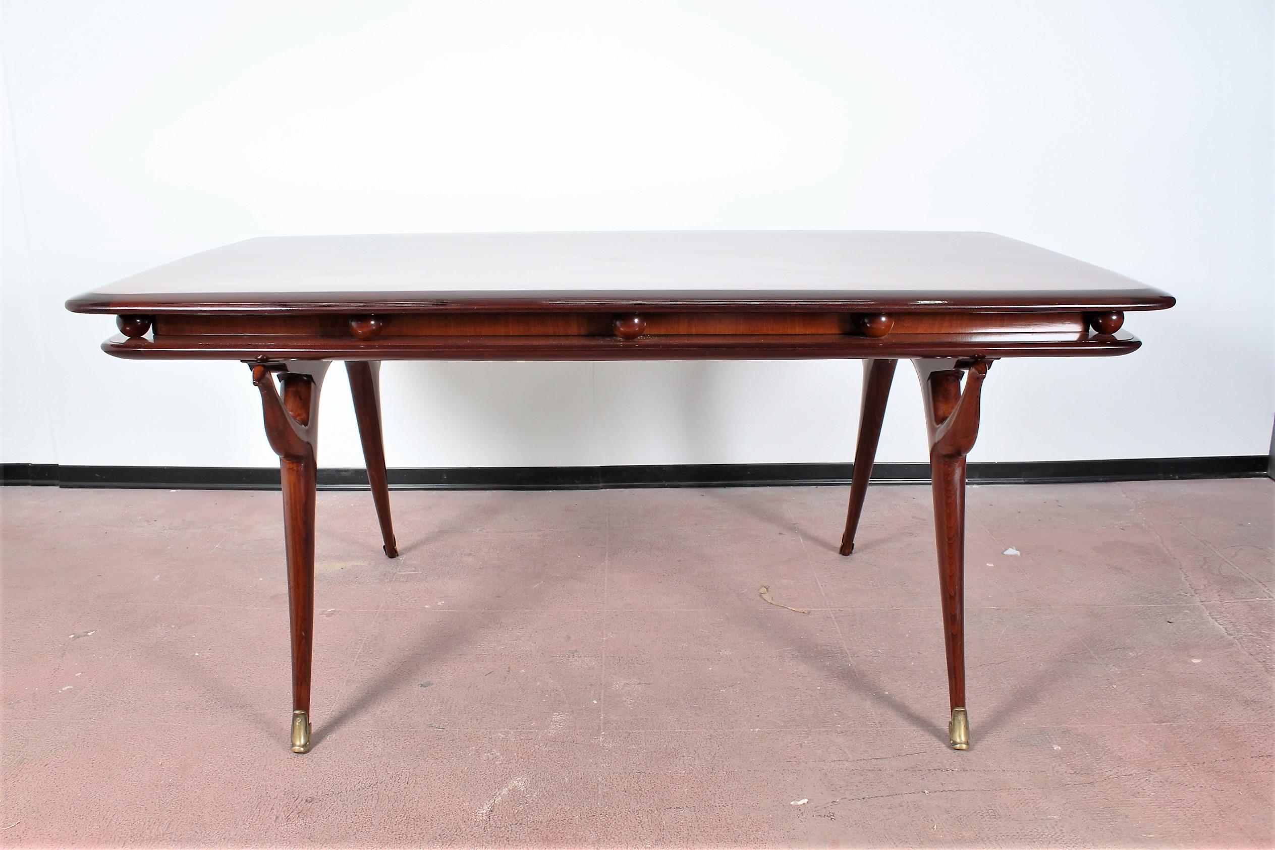 Elegant and prestigious rectangular table in brown wood, with beautiful and original spherical and animal-shaped decorative elements. Attributed to Giuseppe Anzani, Italy, 1950s
The table has been restored.
Wear consistent with age and use.

 