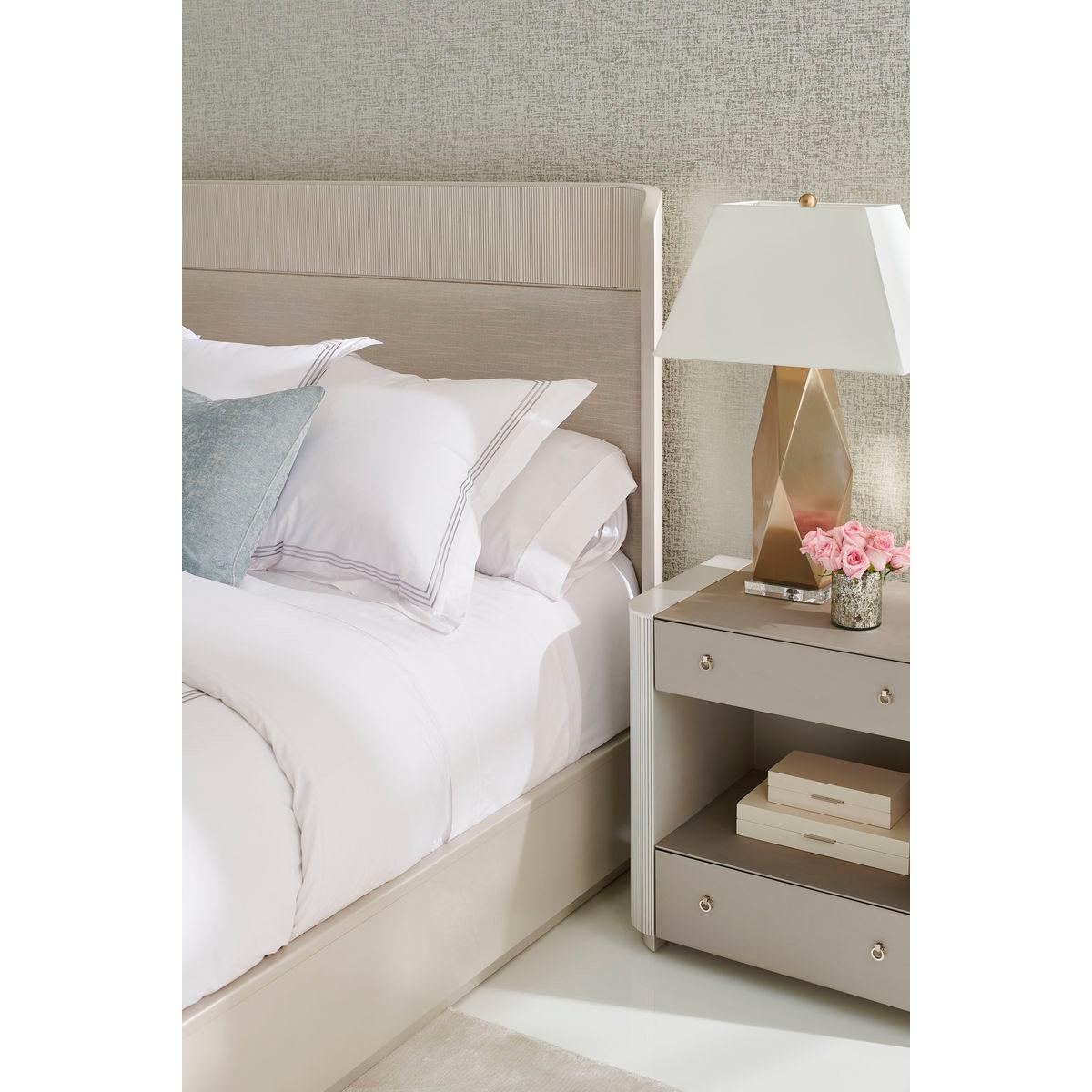 With a softly curved headboard that ensconces you in style, it boasts a thoughtful combination of luxe materials. As you lay back and rest your head, you’ll enjoy the soft support of an exquisitely upholstered headboard framed with wood trim