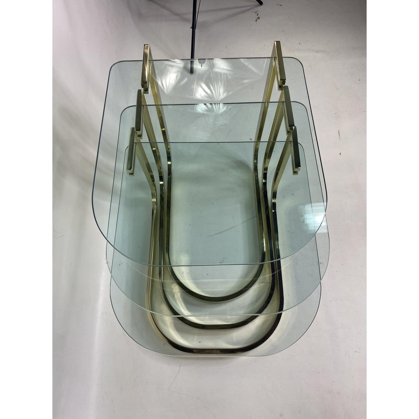 Mid-century glass and brass nesting tables by Design Institute America

Measures: H 22.25 in. x W 20 in. x D 23.75 in.
H 19 in. x W 20 in. x D 23.75 in.
H 16 in. x W 20 in. x D 23.75 in.