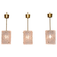 Mid-century glass and brass pendants by Carl Fagerlund for Orrefors