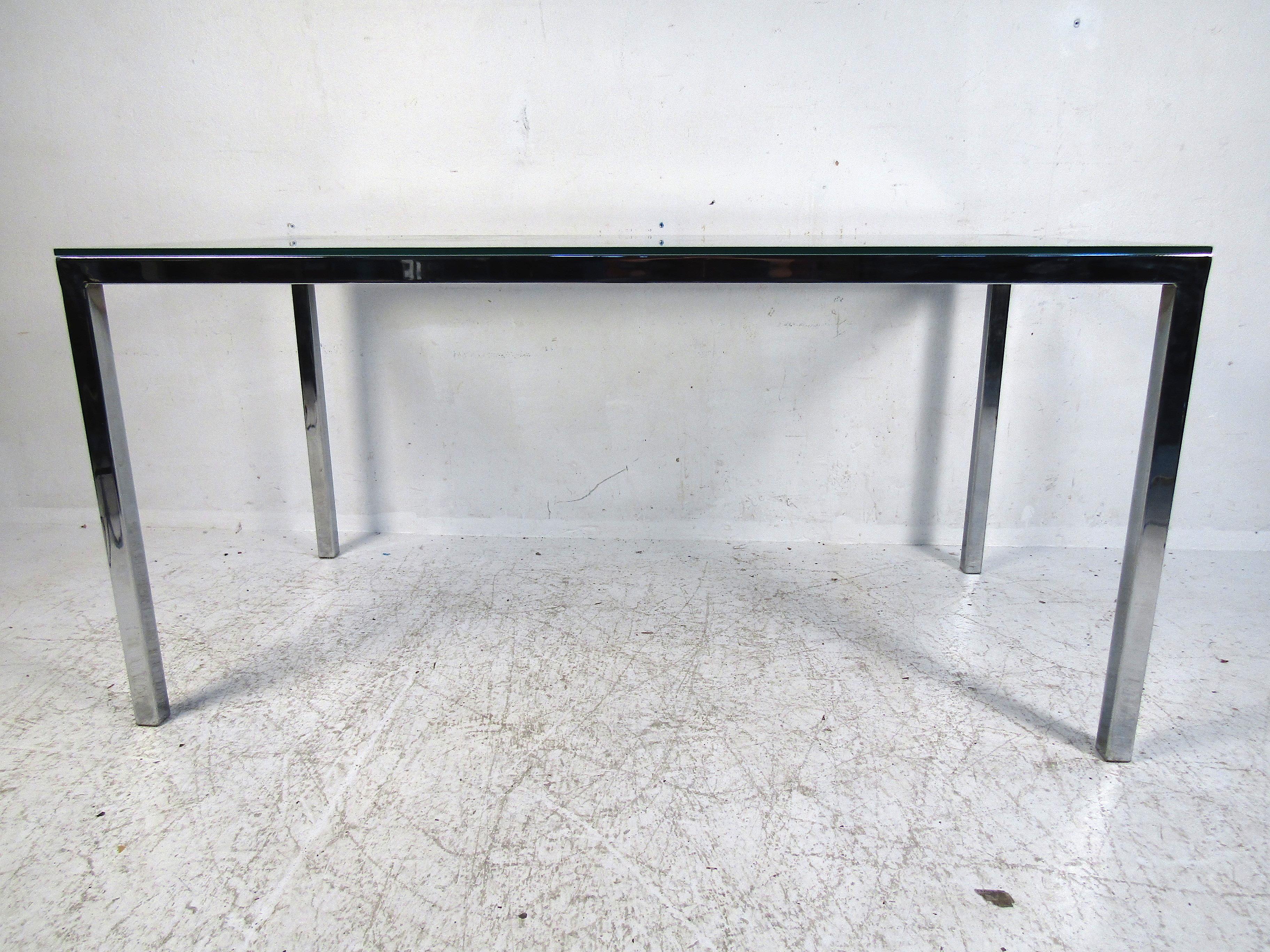 This simple yet elegant dining table will add an element of sophistication to any space. This piece features a sturdy chrome frame and a thick glass top. Suitable for a smaller dining room or large kitchen. Simple and clean this will be a