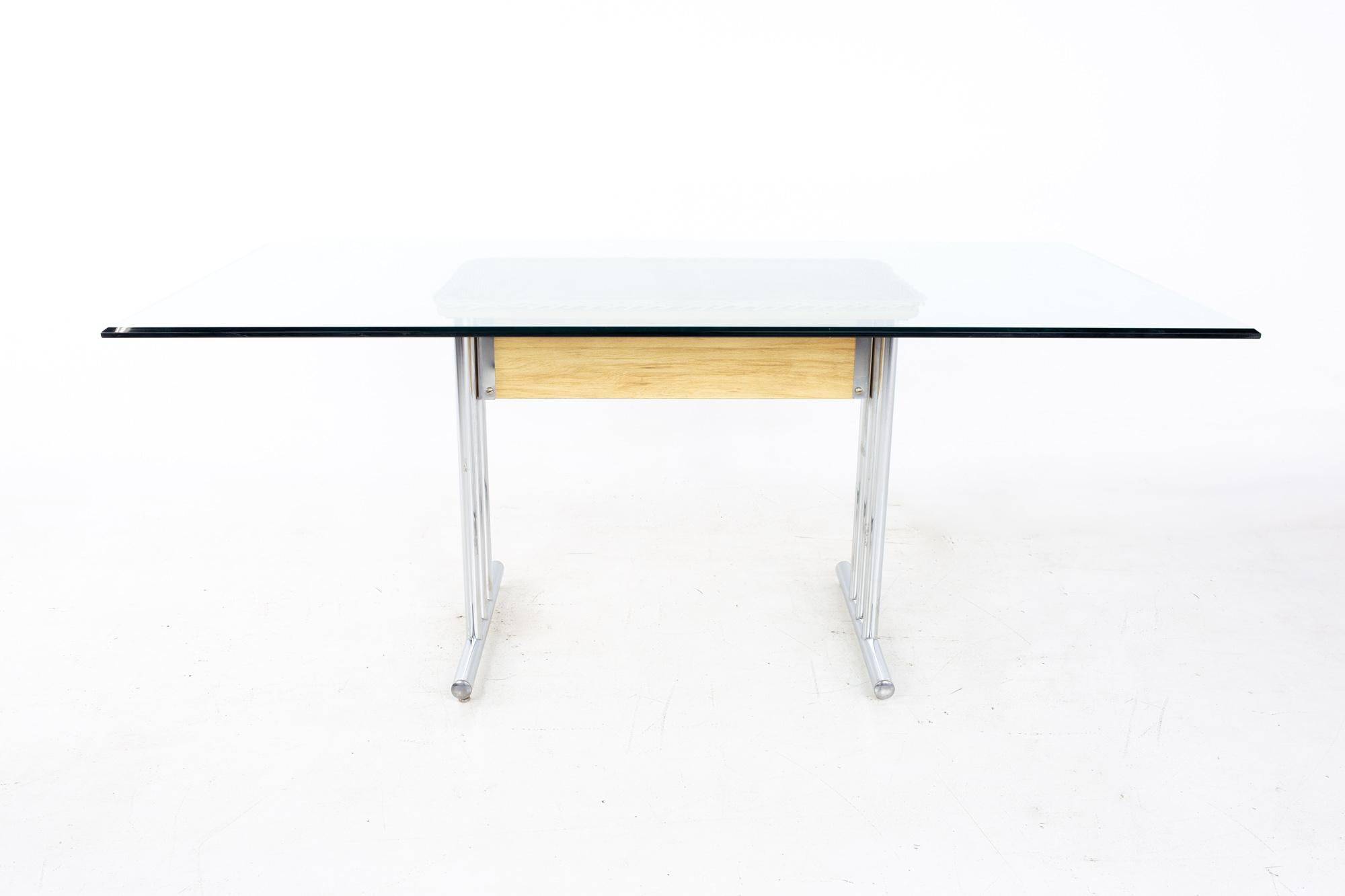 Mid century glass and chrome dining table
Table measures: 72 wide x 40 deep x 30 inches high, with a chair clearance of 28 inches

All pieces of furniture can be had in what we call restored vintage condition. That means the piece is restored