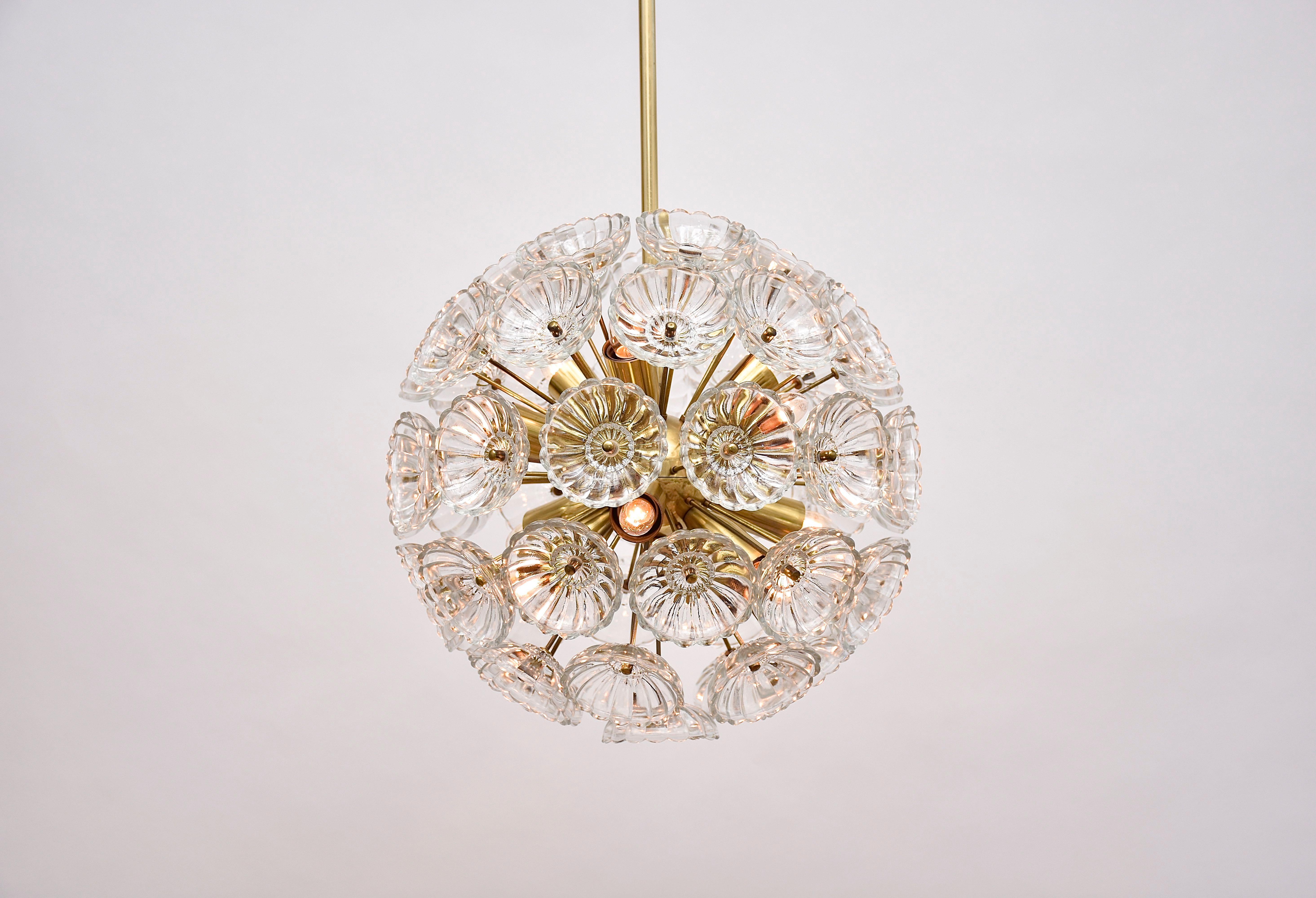 A stunning floral chandelier with 12 light.
With beautiful crystal glass flowers and a polished brass frame.
Period- ca. 1960, mid-century modern
Place of origin- Germany

We personally collected this beautiful chandelier in Berlin, Germany.
