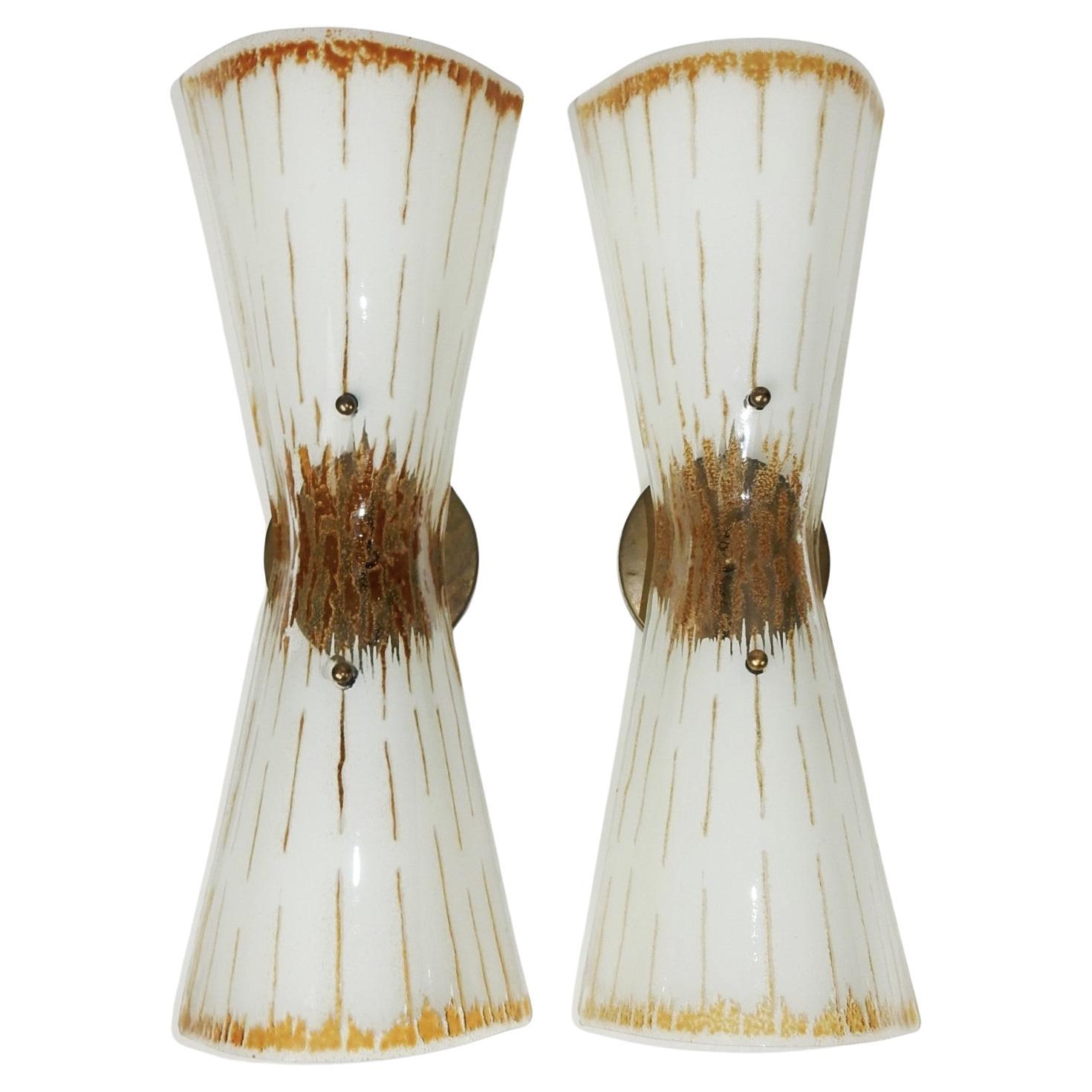 1950's glass hourglass Lightolier wall sconces.
Attributed to Gerold Thurston design.
Textured glass with brass hardware.
4-1/2in wall cap.