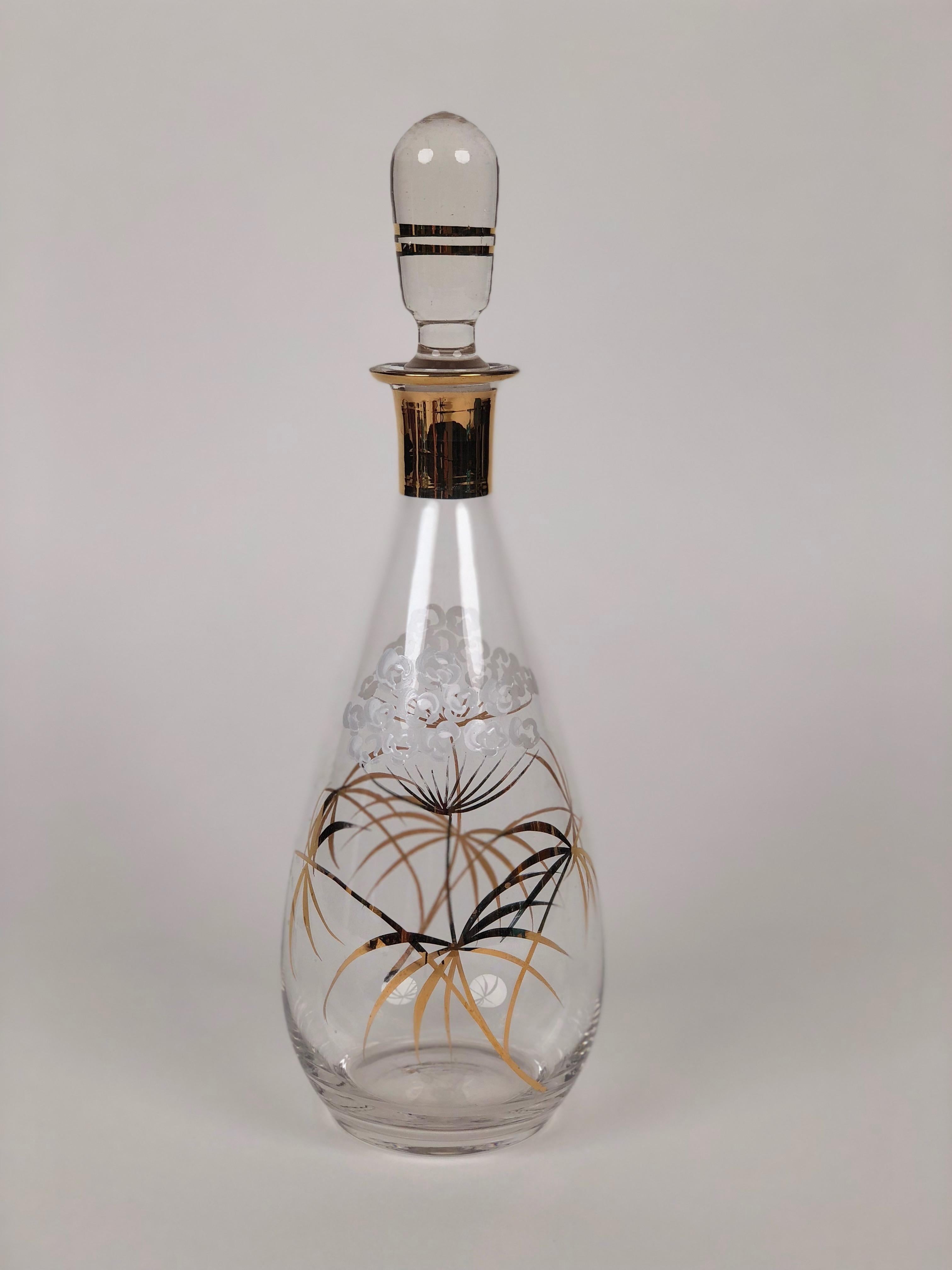 Glass Carafe for liquor with hand painted floral pattern in gold and white.
Made in Czechoslovakia.

You can use them for liquor or as a creative alternative for oils
and vinegars.
