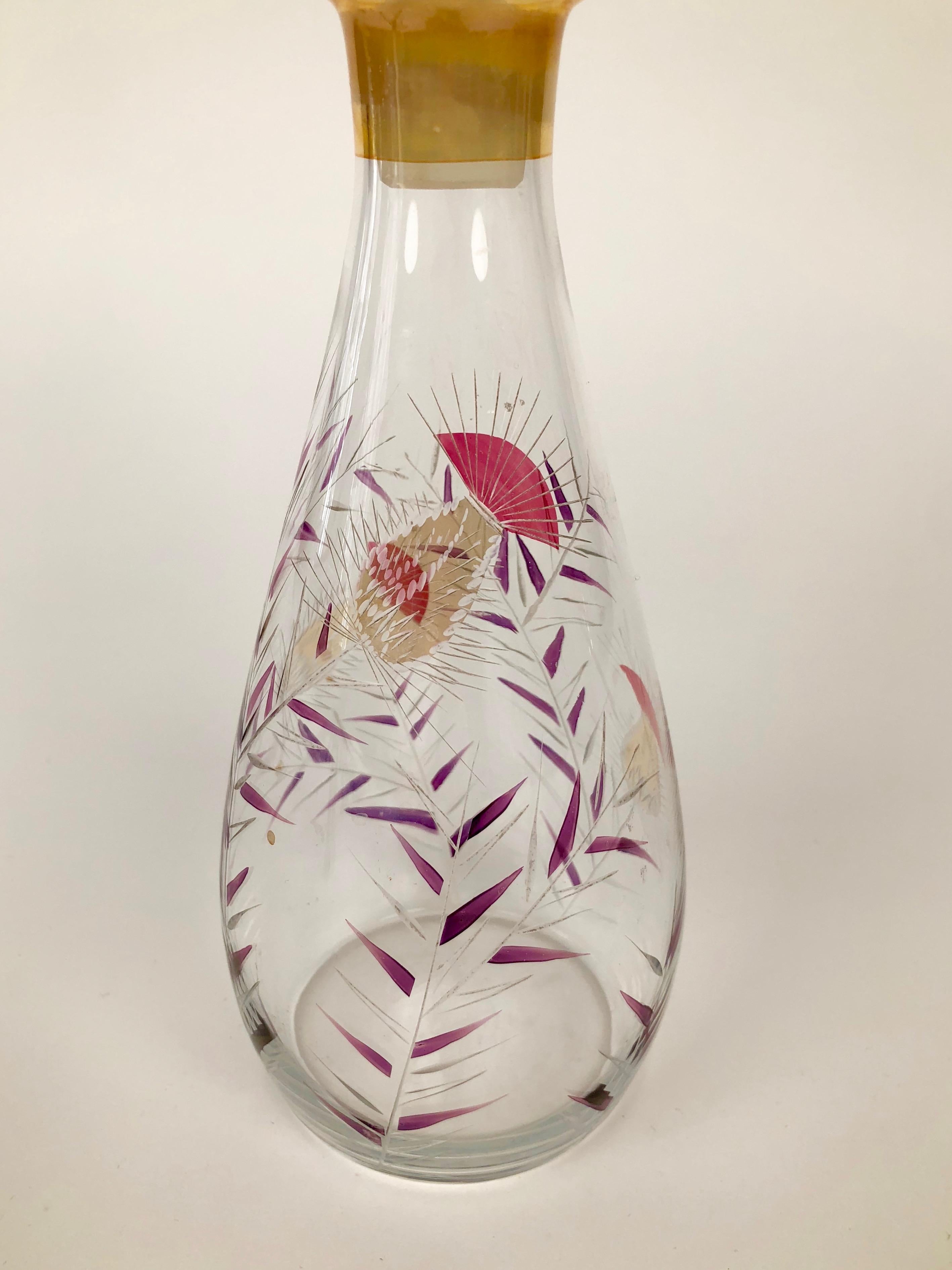 Glass carafe for liquor with hand painted thistle pattern. The details in the patterns are cut in the glass.
Made in Czechoslovakia.

You can use them for liquor or as a creative alternative for oils
and vinegars.
  