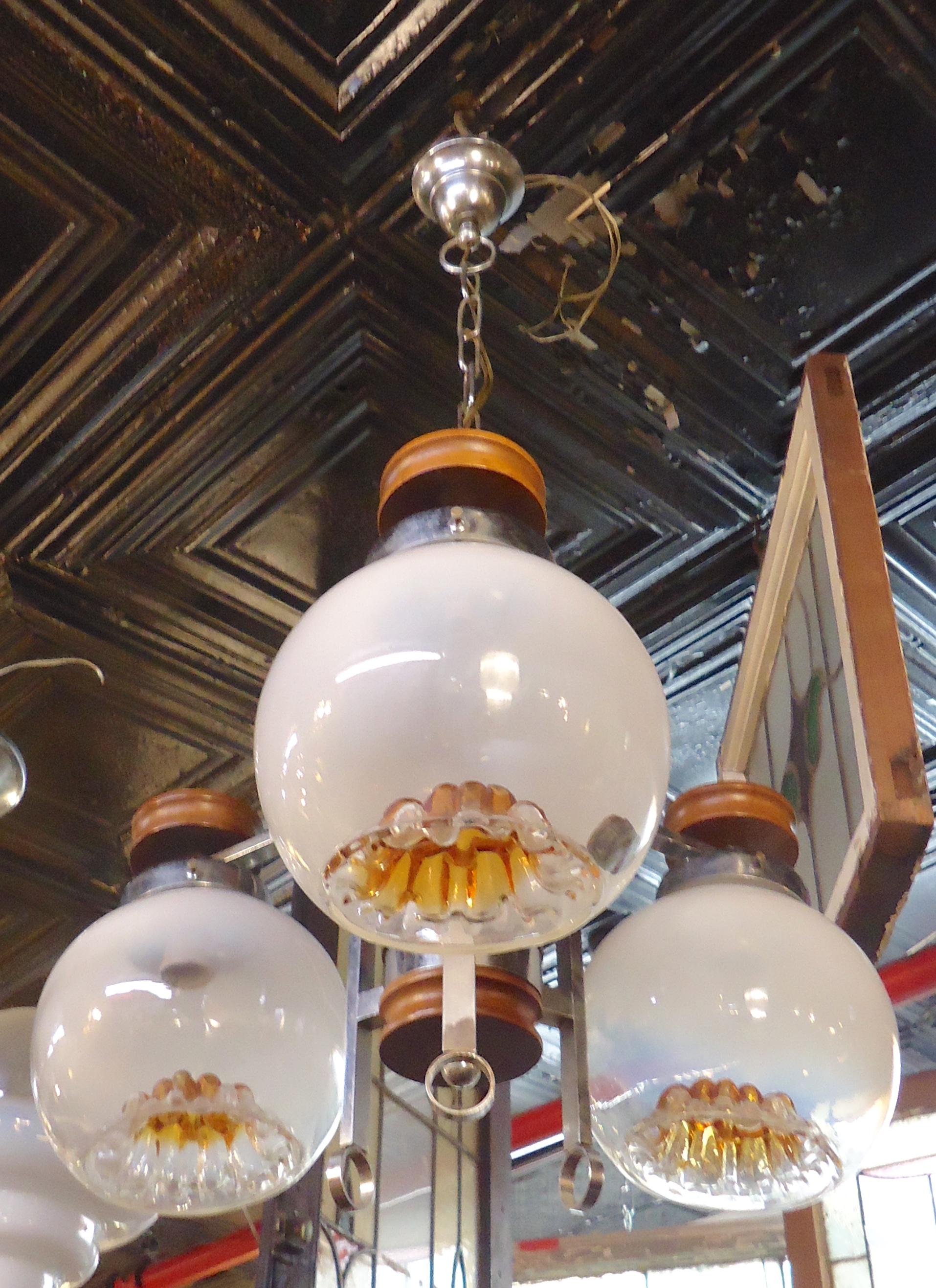 Vintage modern hanging chandelier with three blown globes. Chrome frame and amber colored glass shades.
(Please confirm item location - NY or NJ - with dealer).
 