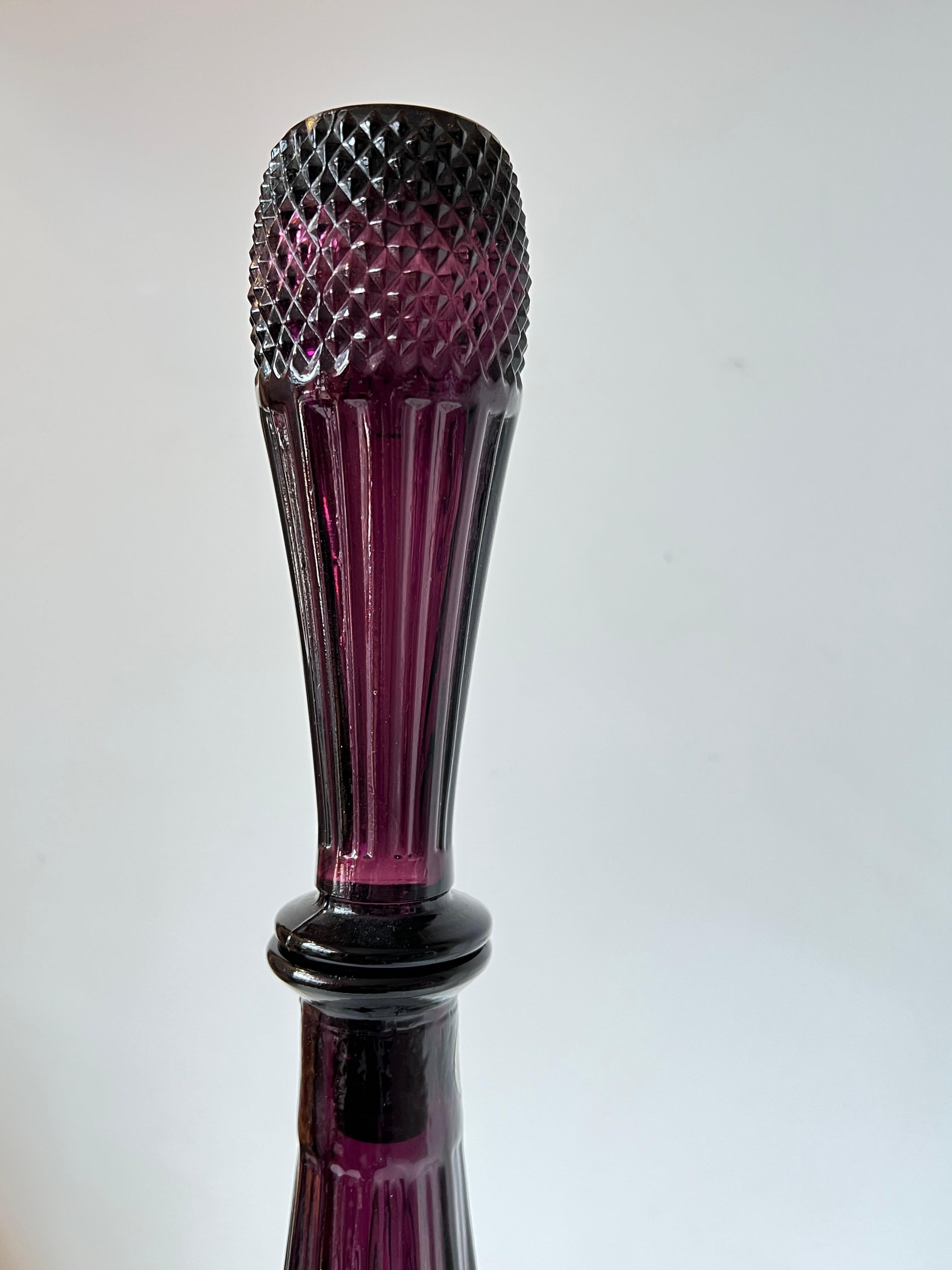 Empoli bottle or decanter, called Genie bottle, with stopper. 
In an original purple colour
Made in Italy, Empoli, fifties/sixties period. 
