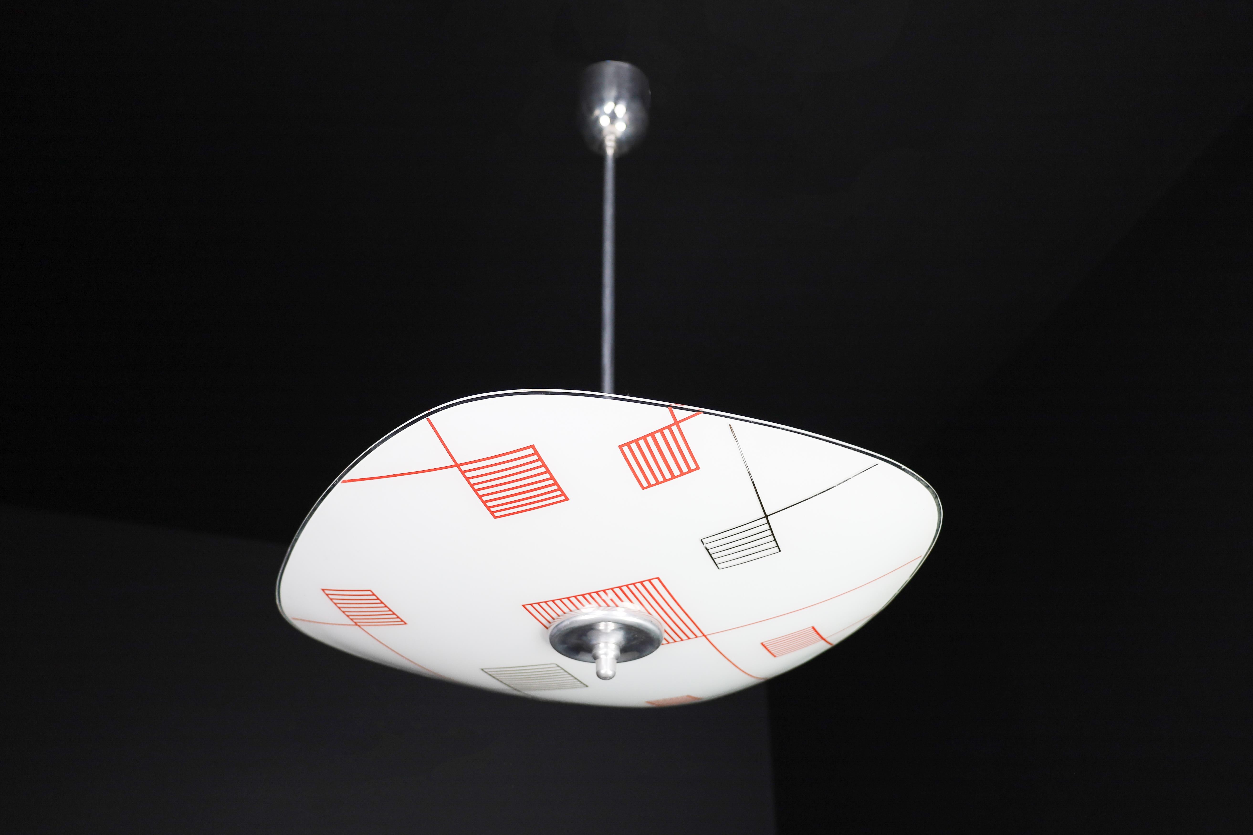 Mid-Century Glass Hanging Pendant Lamp Brussels World Expo 1958 (5115)

This pendant lamp is a magnificent piece of mid-century graphics and design that was showcased at the Czechoslovakia Pavilion during the Brussels World Fair in 1958. The shade