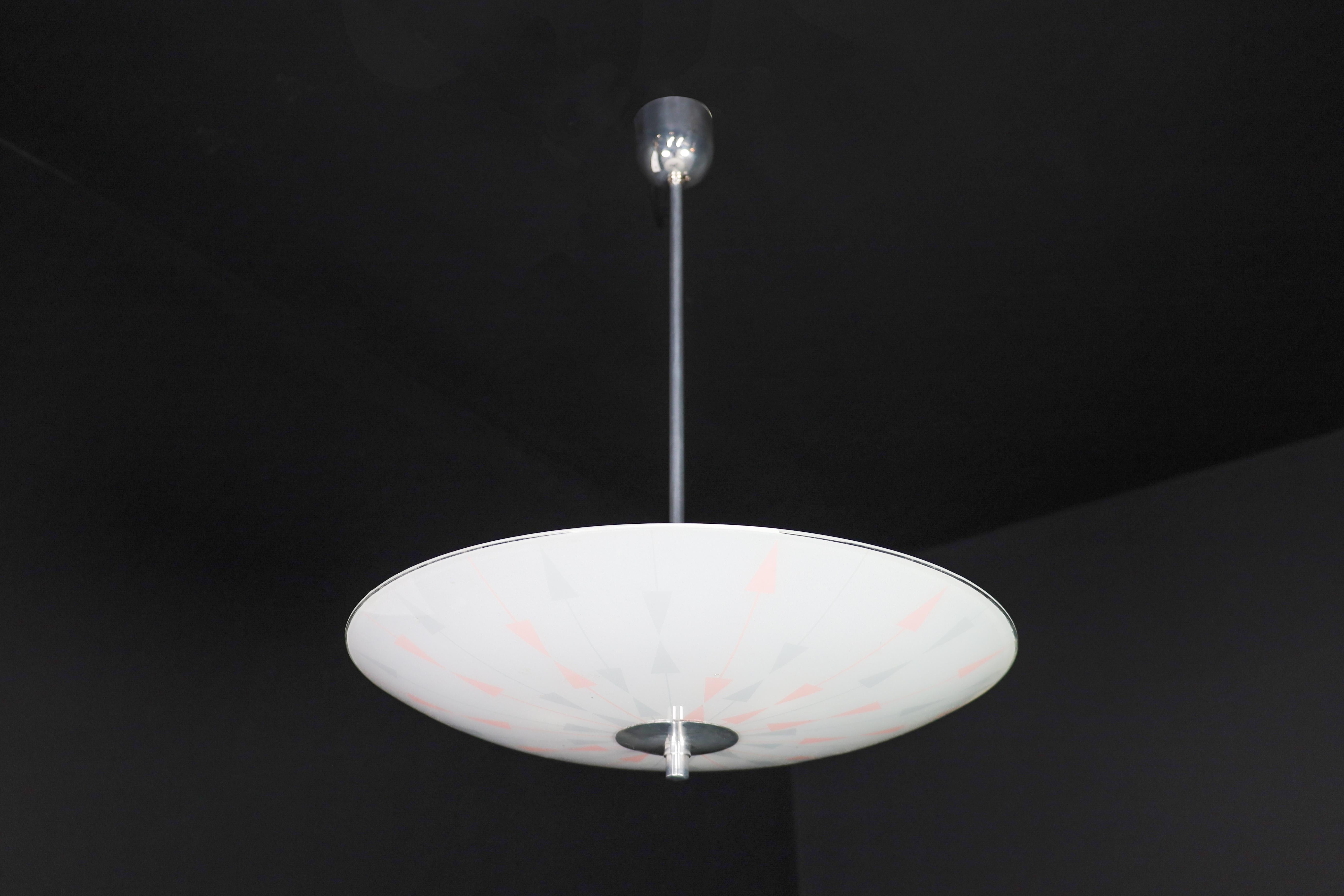 Mid-Century Glass Hanging Pendant Lamp Brussels World Expo 1958 (5116)

This pendant lamp is a magnificent piece of mid-century graphics and design that was showcased at the Czechoslovakia Pavilion during the Brussels World Fair in 1958. The shade