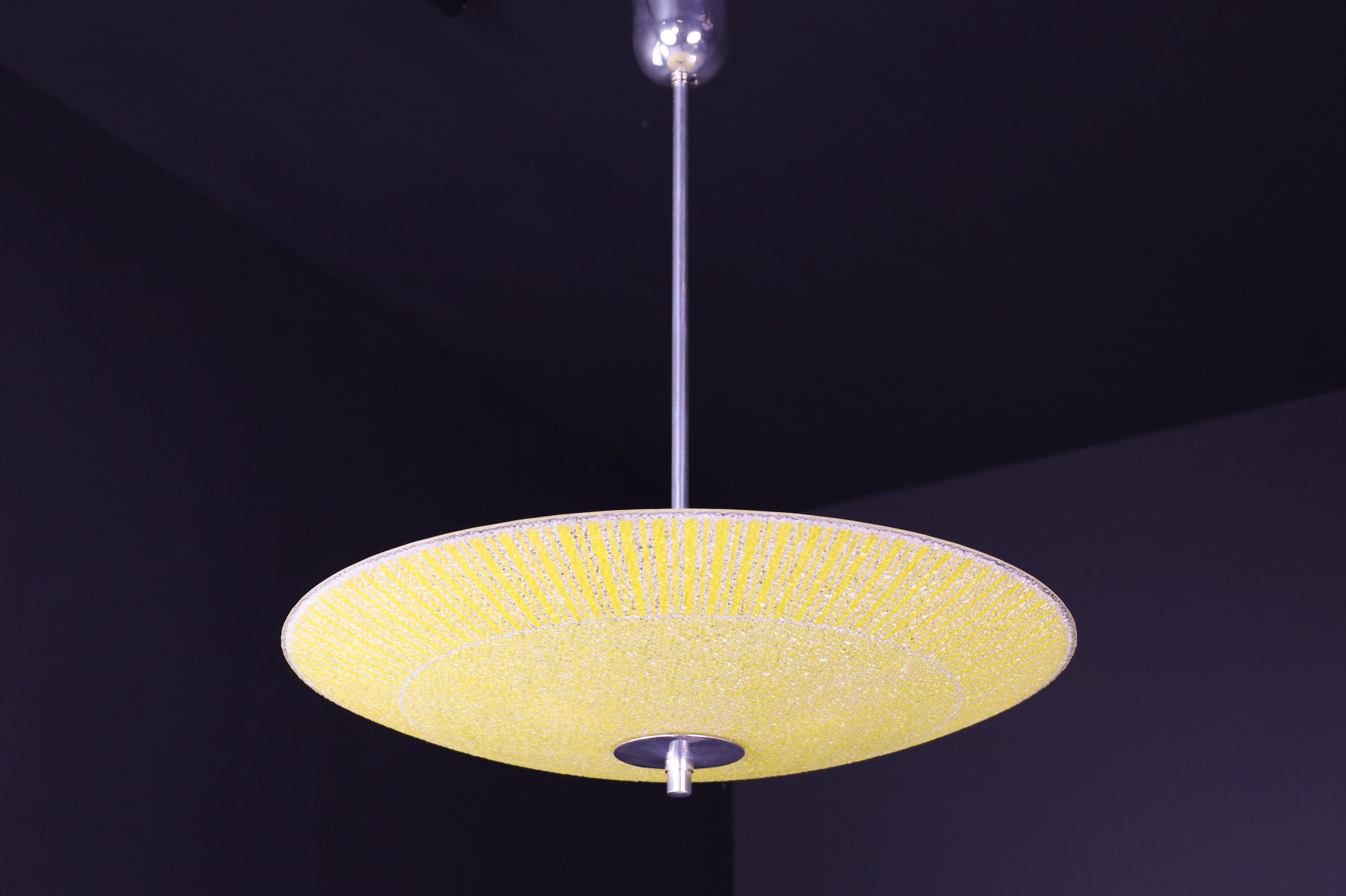 Mid-Century Glass Hanging Pendant Lamp Brussels World Expo 1958

This pendant lamp is a magnificent piece of mid-century graphics and design that was showcased at the Czechoslovakia Pavilion during the Brussels World Fair in 1958. The shade is in