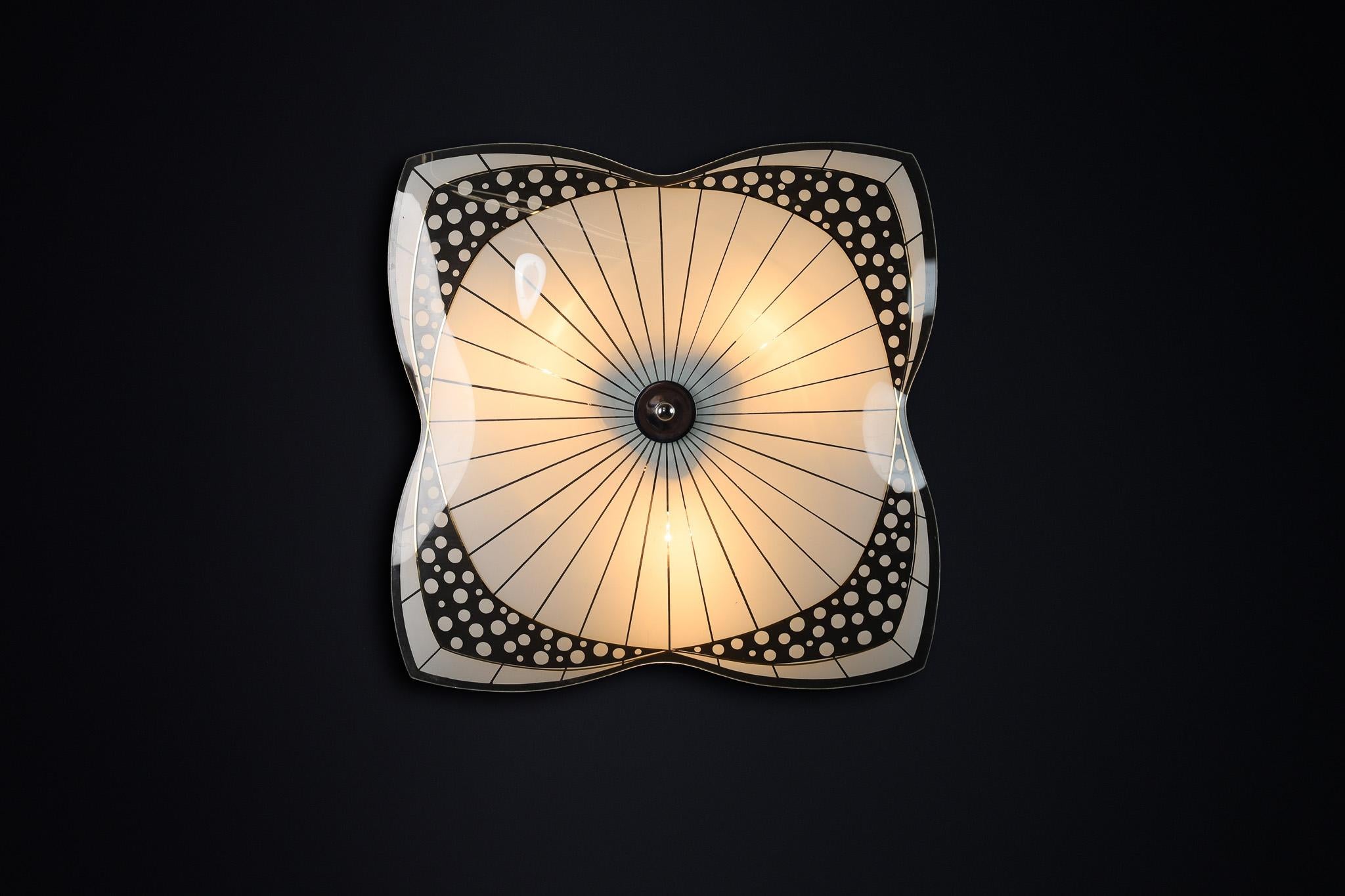Mid-Century Glass Hanging Pendant Lamp or Wall Light Brussels World Expo 1958 (no:30)

This lighting is a stunning example of mid-century design and graphics, showcased at the Czechoslovakia Pavilion during the Brussels World Fair 1958. The