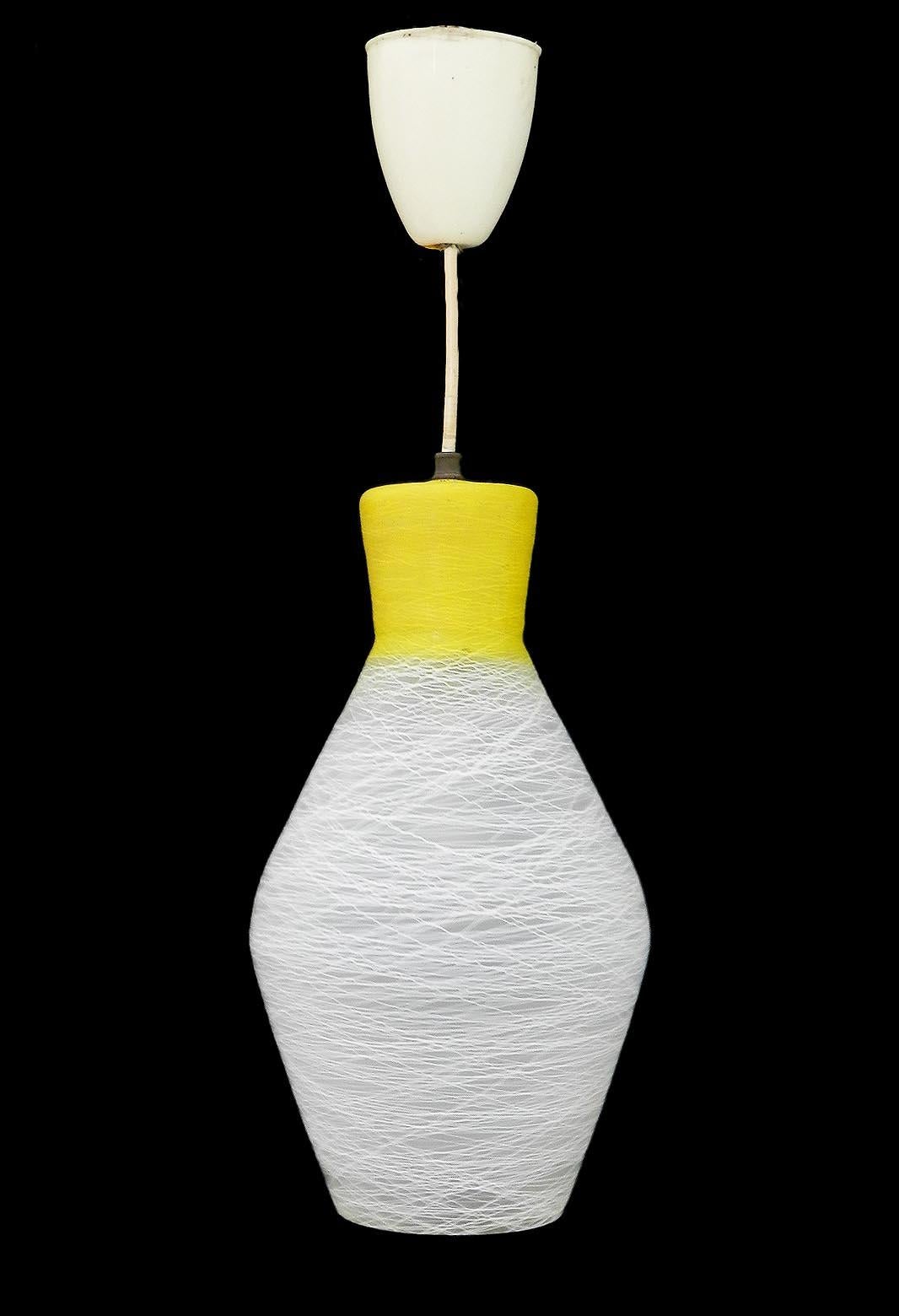 1960s glass pendant light chandelier midcentury
Yellow and white marble pattern glass
Italian Murano glass
This can be rewired to USA, UK and European standards
Very good condition with only very minor signs of age
Easily extended to the drop