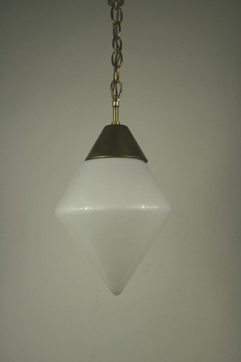 a milk glass / brass hardware single light pendant.
2 available 
Price individually.
    