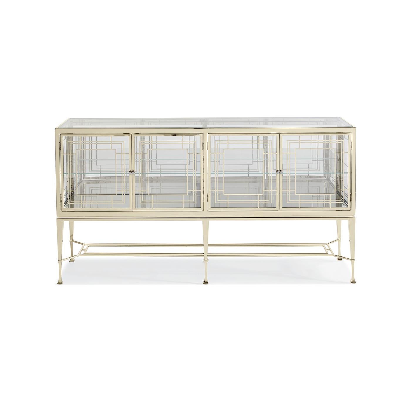 Mid-century glass sideboard, as glamorous as gold jewelry sparkling in the light, this brilliant glass sideboard reflects beauty from every angle. It’s crafted of clear glass panels and features a glass top, glass end panels, glass shelf and four
