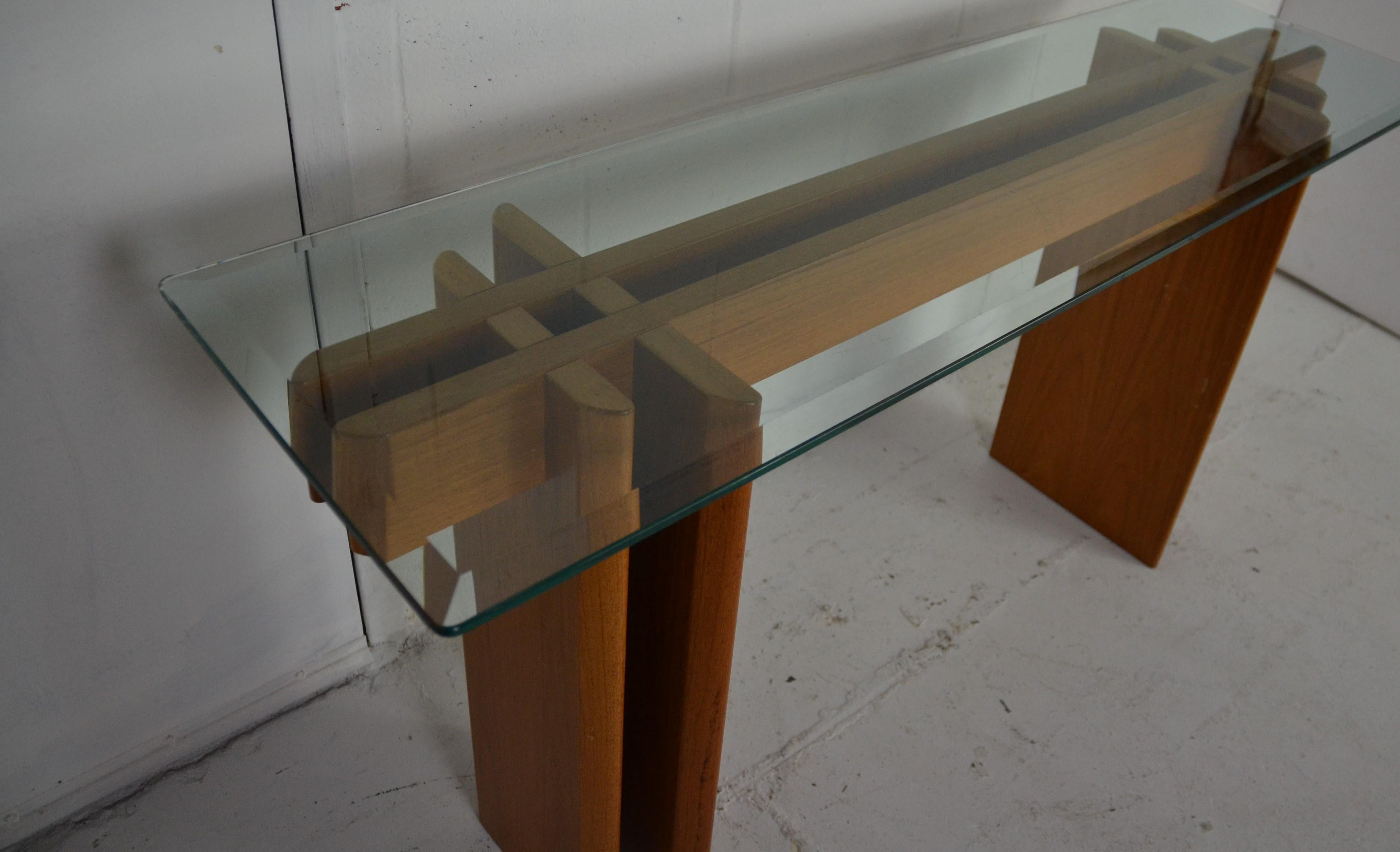 Glass top midcentury console. The glass is beveled.