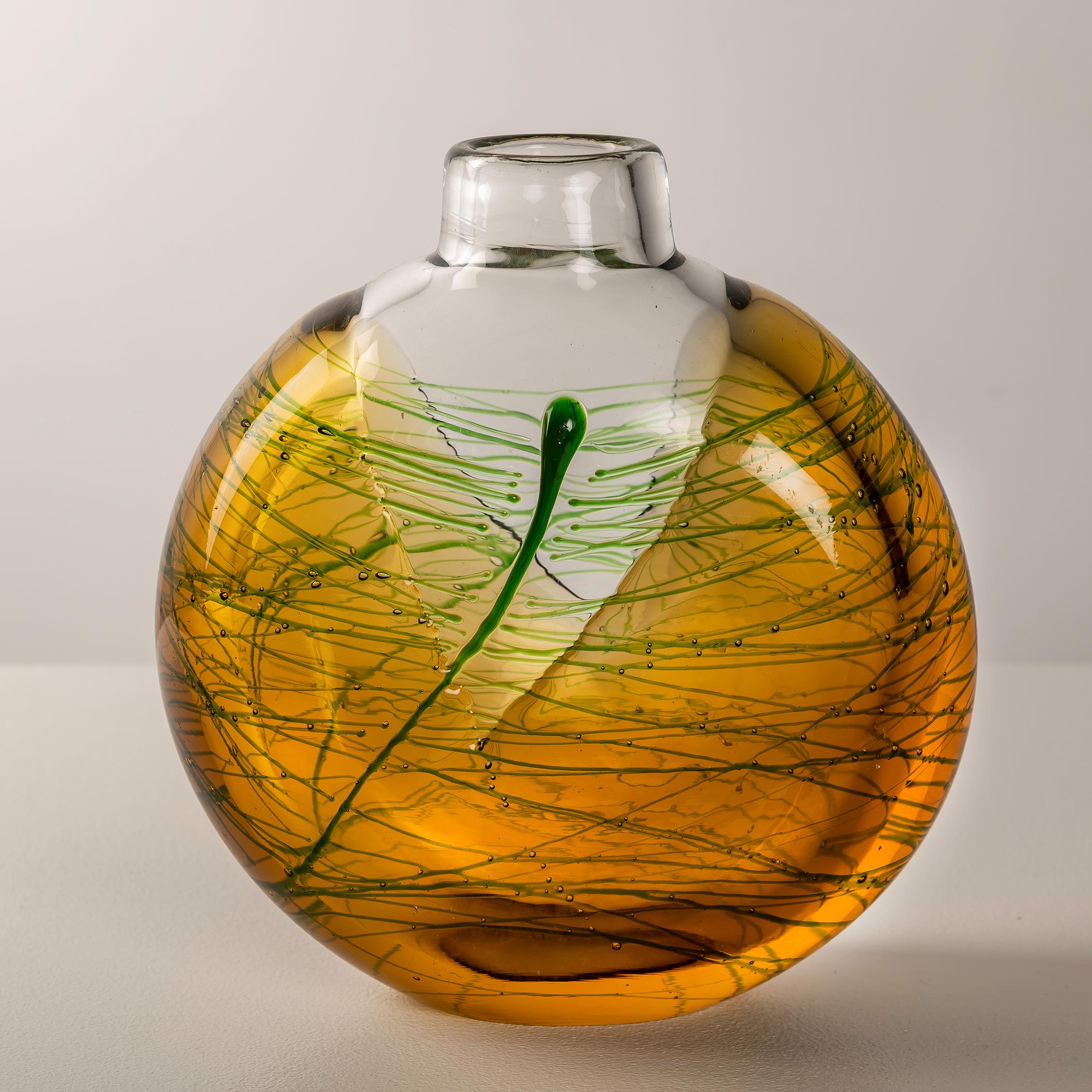 Investing in this Mid-Century Glass Vase by Jiri Suhajek for Moser, originating from the 1970s, offers a unique opportunity to own a piece of artistry that seamlessly blends elegance with innovation. Jiri Suhajek, known for his innovative glass