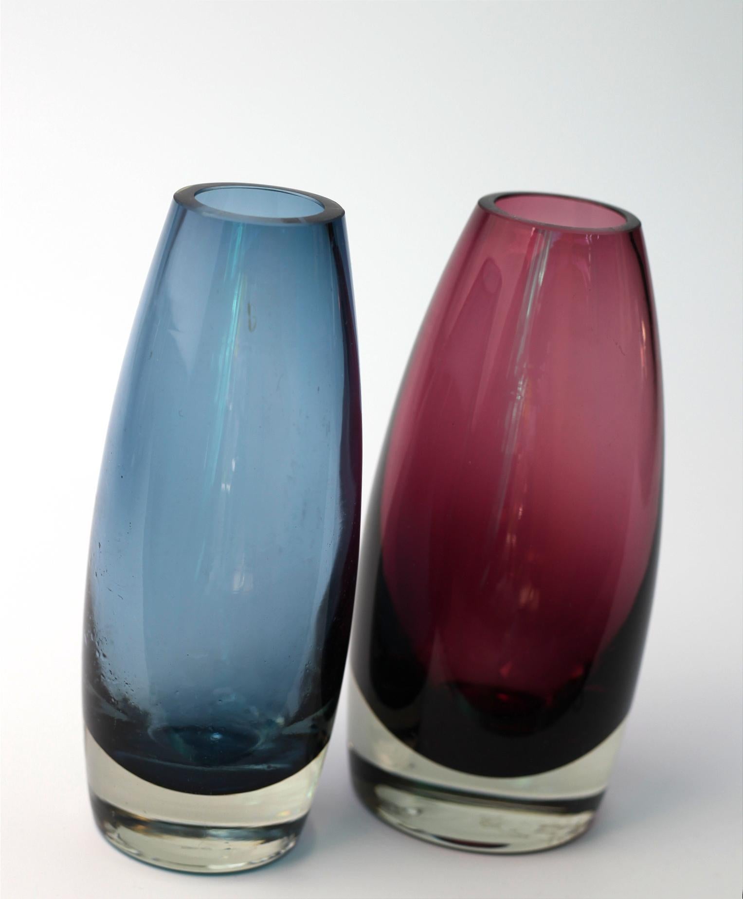 This is a nice pair of two handmade glass vases from Finland. 

Measures: Hight 16 CM. 
Width 7 CM

They are both signed. 
    