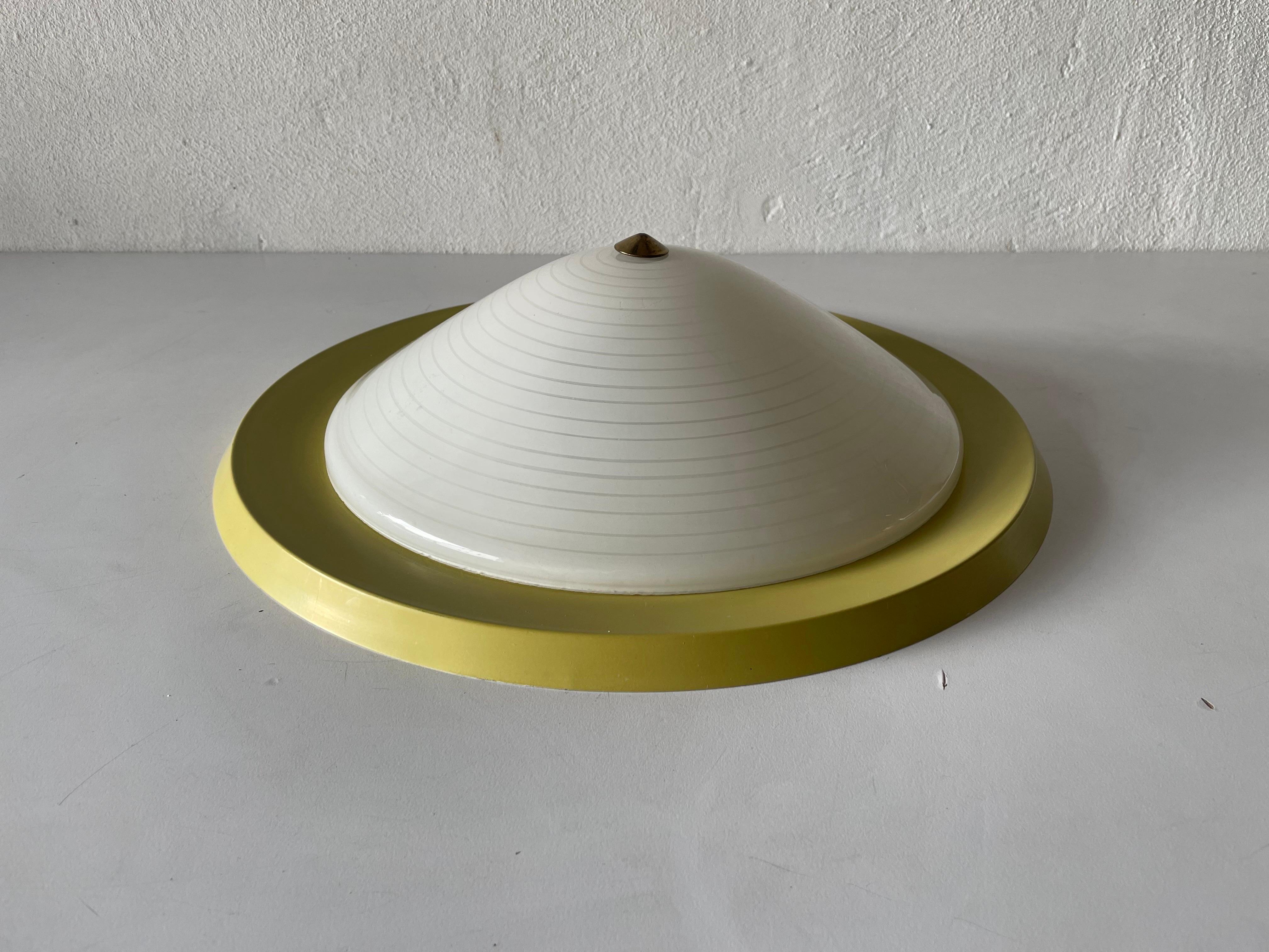 Mid Century glass & yellow metal flush mount ceiling lamp, 1950s, Germany

Lampshade is in very good vintage condition.

This lamp works with E27 light bulb. 
Wired and suitable to use with 220V and 110V for all