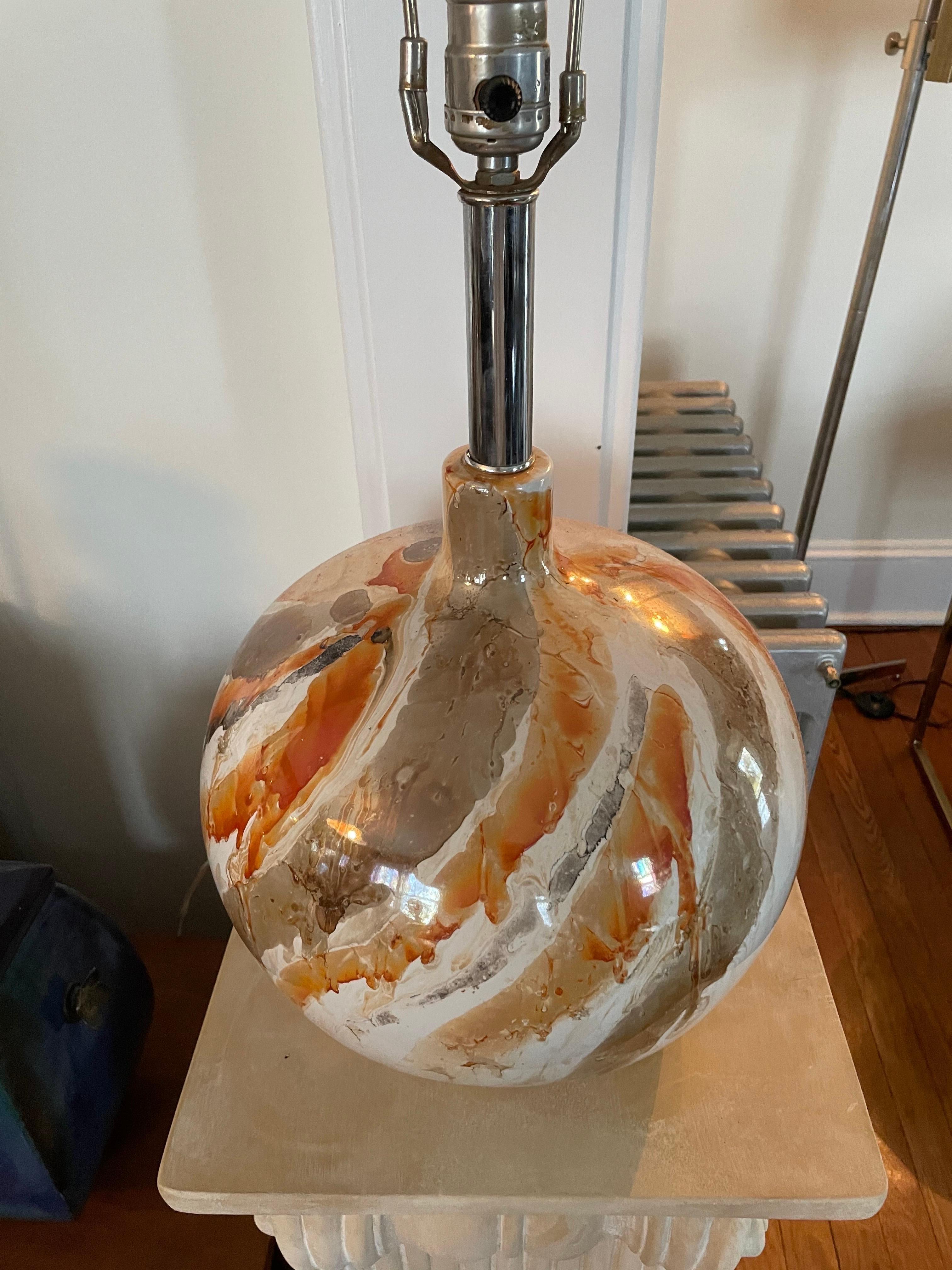 Present Glazed Faux marble lamp. Great mid century staple. Brown and Orange veining with nice movement. Measures 18.5 inches to top of socket.