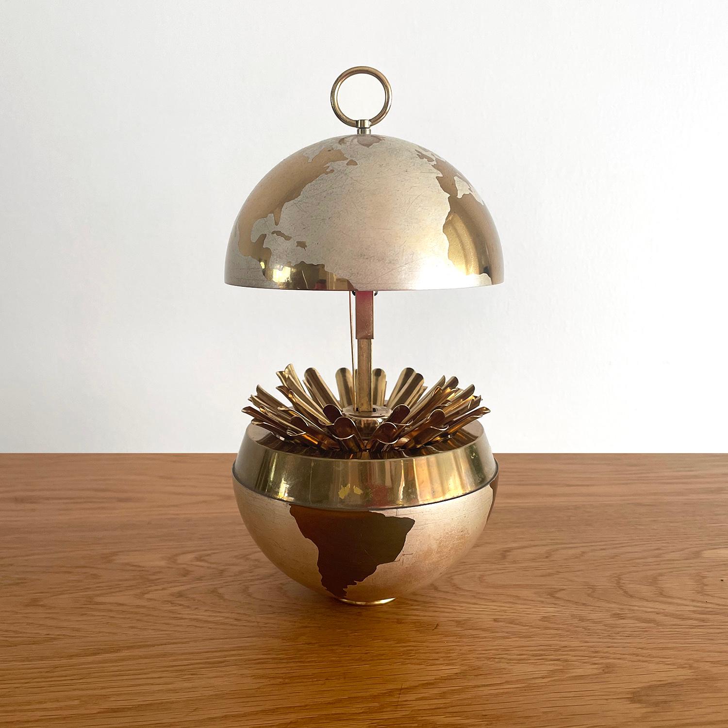 Both functional and fun!
This timeless classic will brighten any surface 
Brass toned globe opens to reveal a hidden pop up cigarette compartment
or leave it shut and it doubles as a stunning piece of art
Pop up mechanism works smoothly
Light