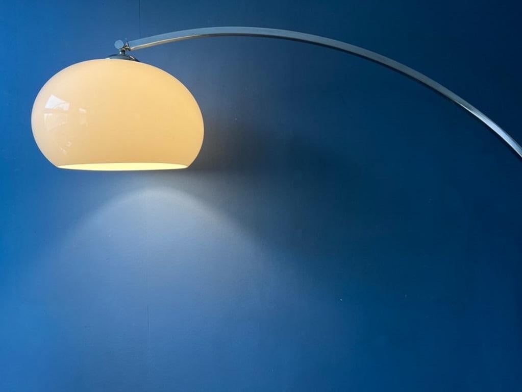 Very rare Italian arc floor lamp with mushroom shade attributed to Goffredo Reggiani. The white shade produces a delicate, warm glow. The height/length of the lamp can be adjusted with its extendable arm. The lamp requires one E26/27 (standard)