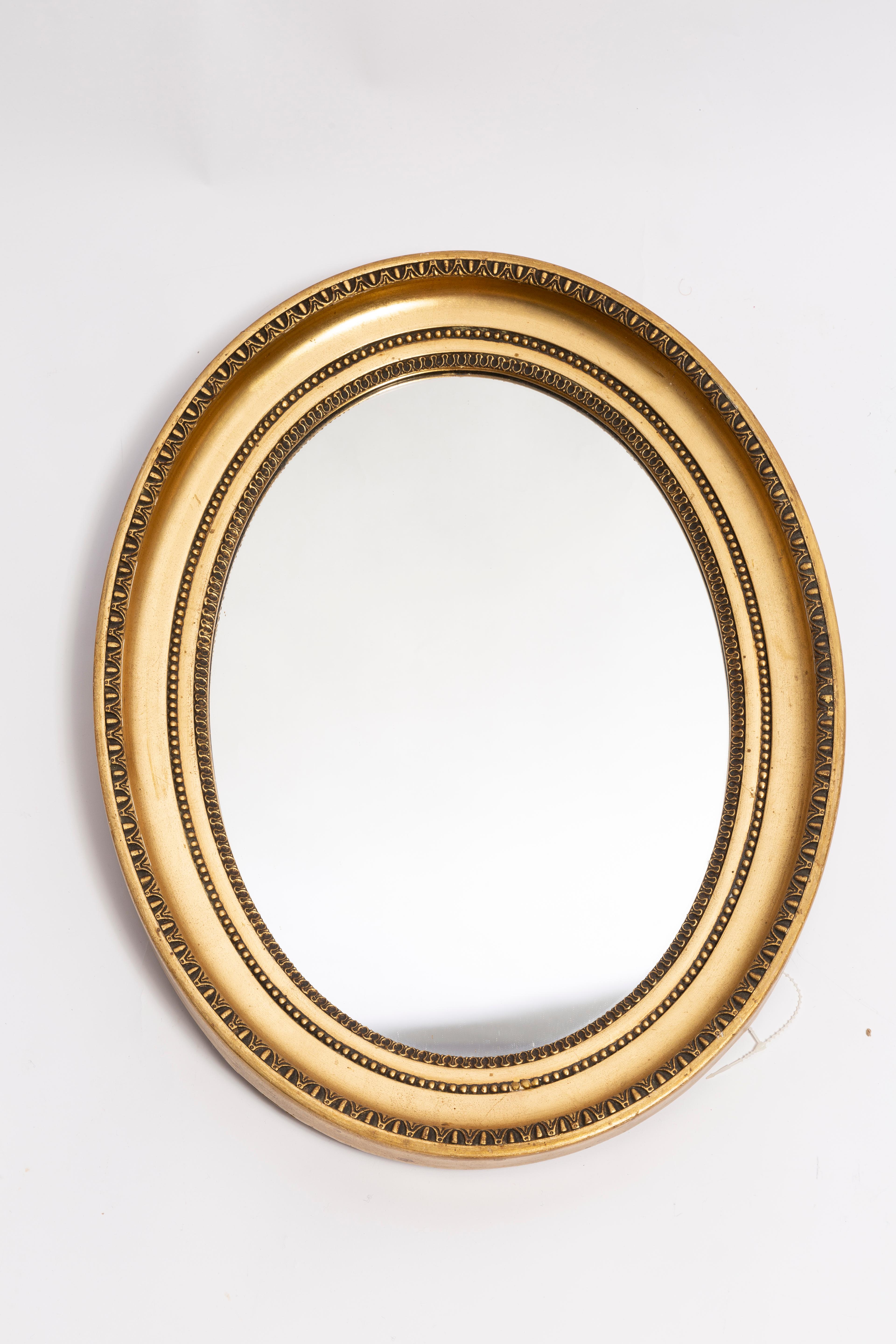 A beautiful big oval mirror in a golden decorative frame with flowers from Italy. The frame is made of wood. Mirror is in very good vintage condition - no damage or cracks in the frame. Original glass. Really unique piece for every interior! Only