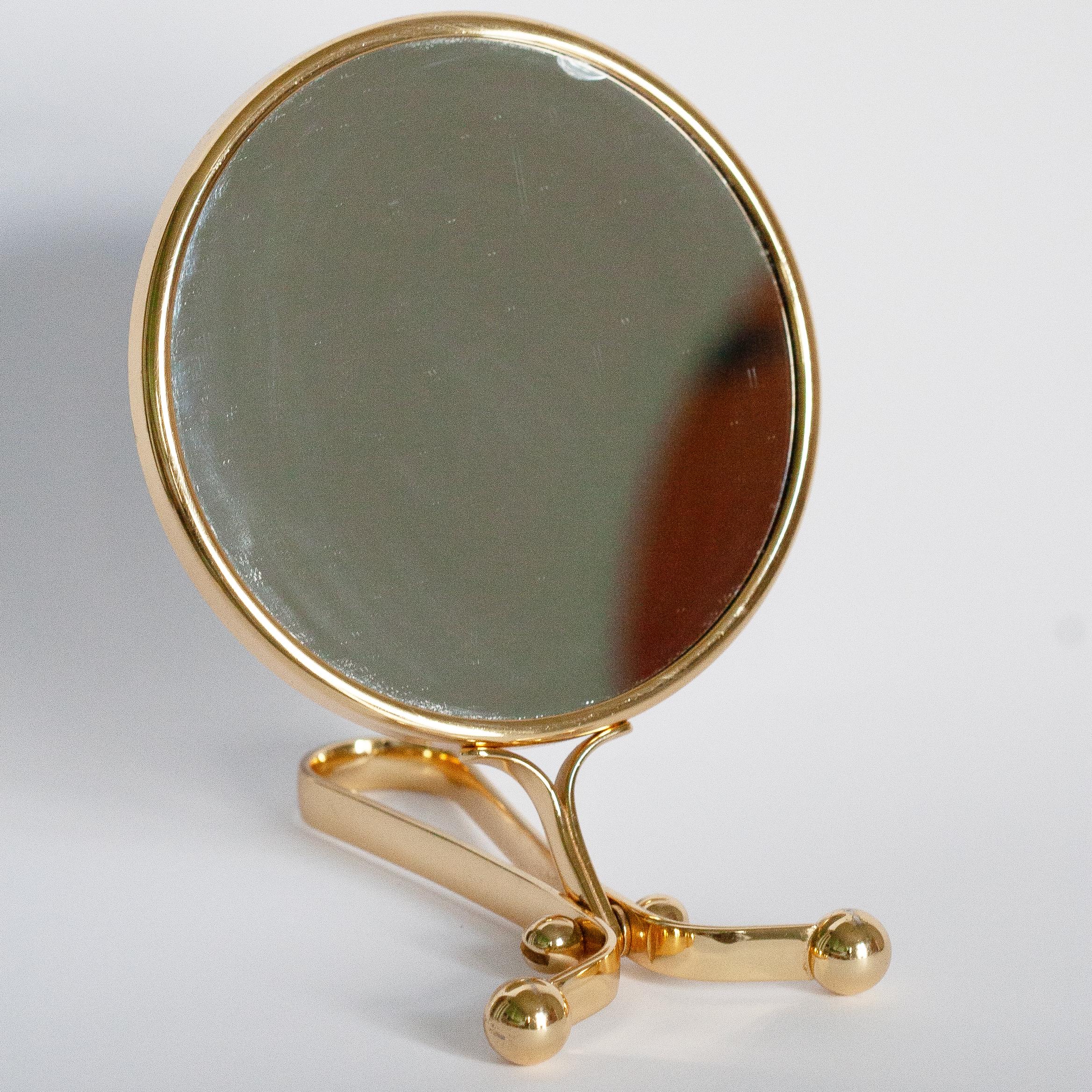 A beautiful mirror in a golden decorative frame from Italy. The frame is made of metal. Mirror is in very good vintage condition - one chip on the mirror - as shown on pictures. Original glass. Really unique piece for every interior! Only one piece