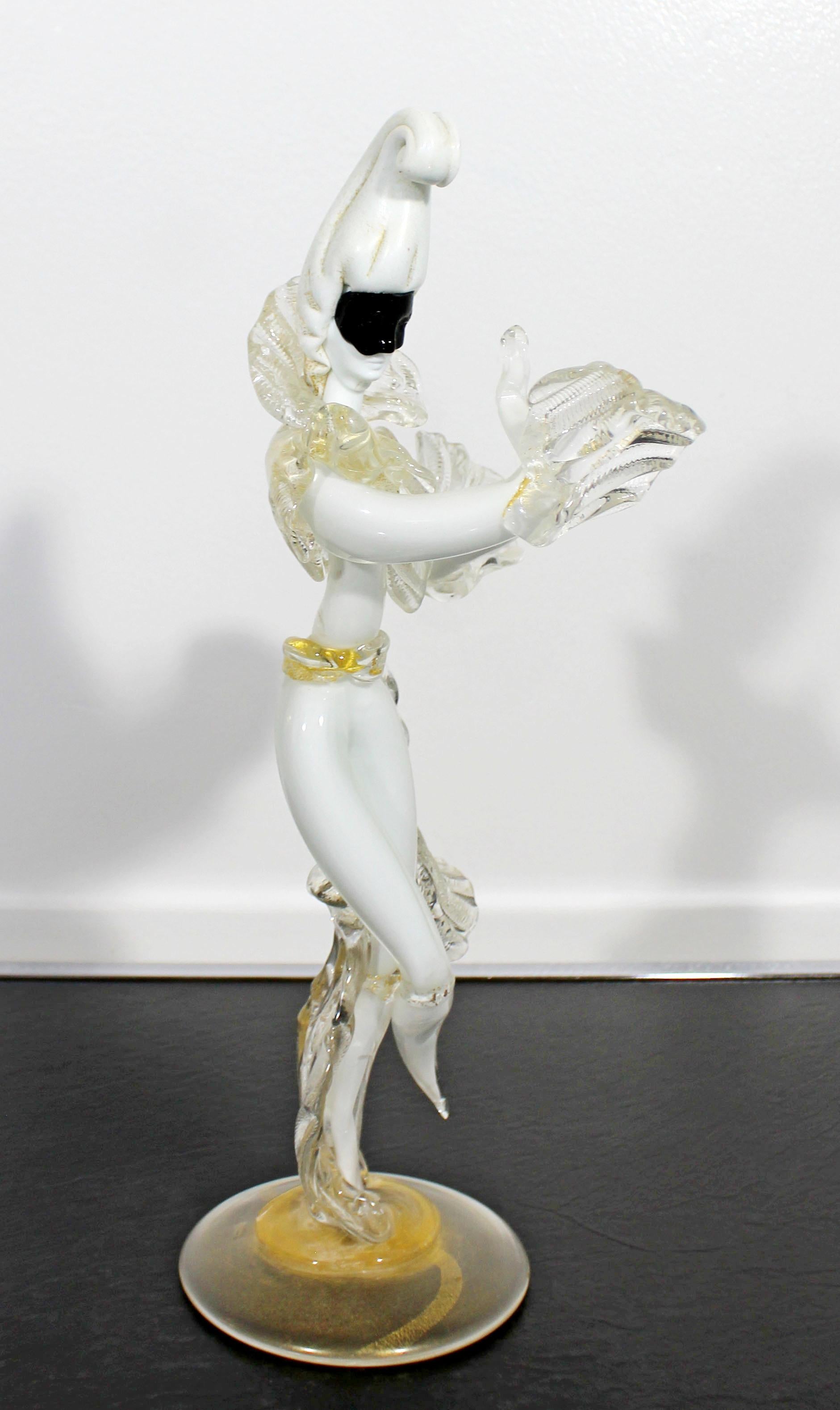 For your consideration is an incredible, white and gold flecked Murano glass gentleman table sculpture, in the style of Barovier Toso and Seguso, circa 1960s. In excellent condition. The dimensions are 6