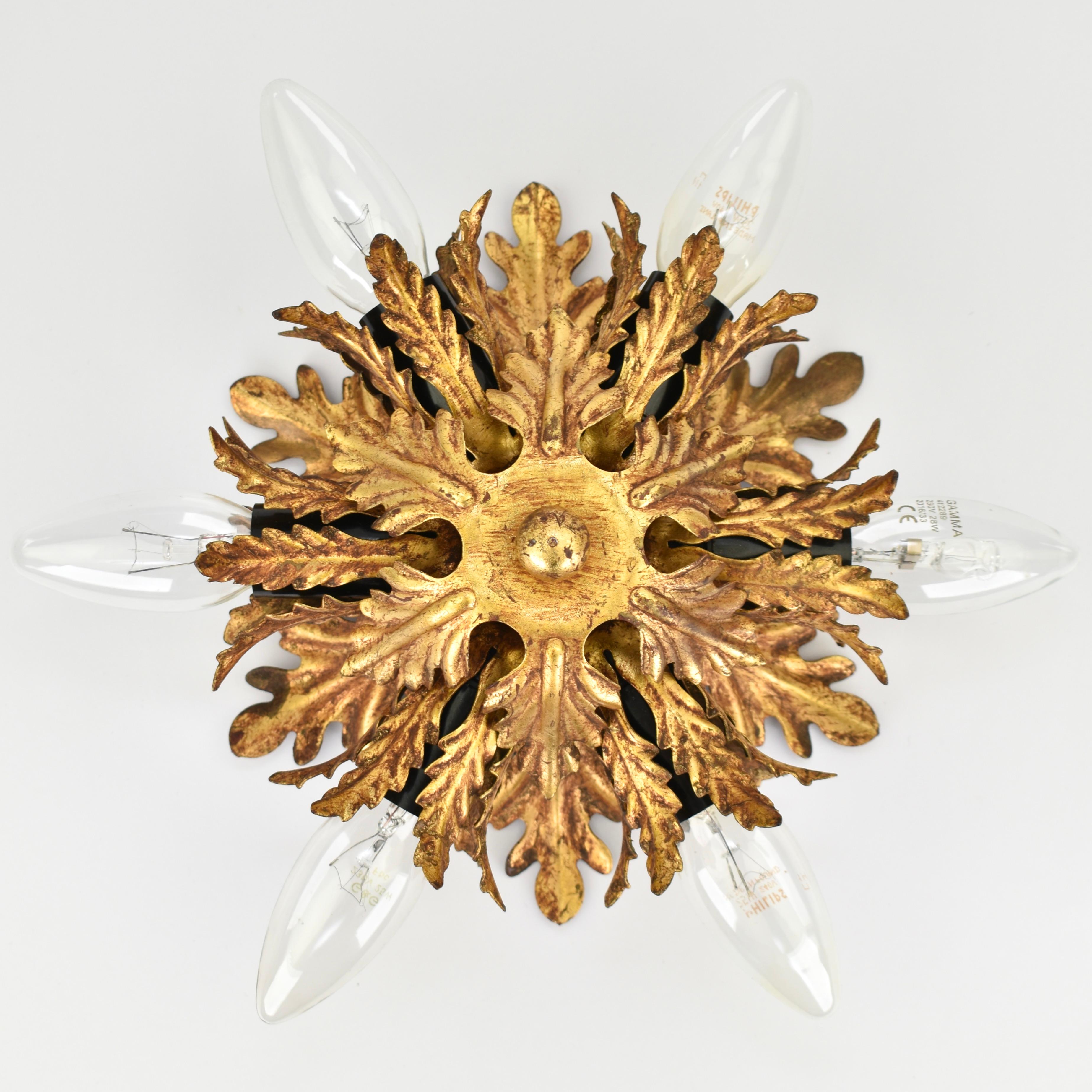Stunning Italian ceiling light with gold plated leafs. This light was made by Banci Firenze in Italy in the 1960s. The lamp can take 6 lightbulbs, each with an E14 fitting size (available online 120-220 volts).

In great vintage condition and in