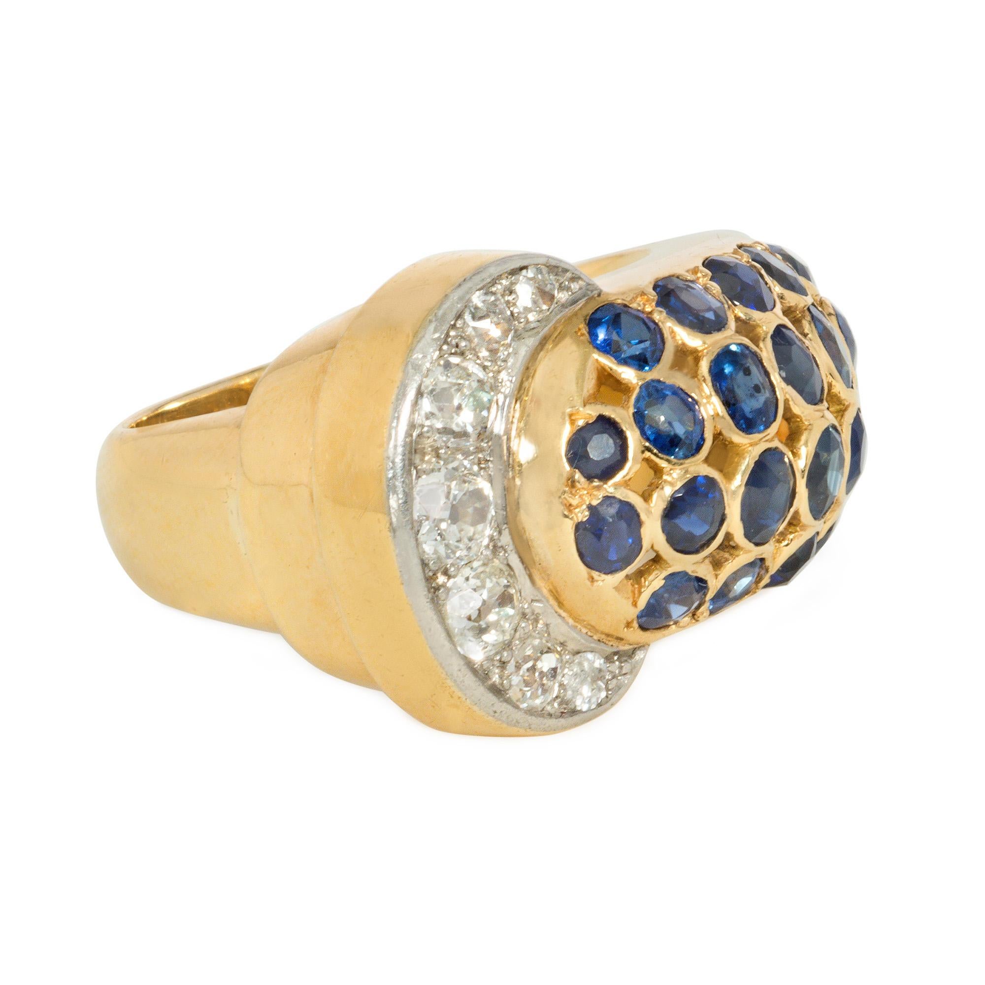 A Mid-Century sapphire, diamond, and gold band-style ring of stylized belt strap design, comprised of four rows of bezel-set sapphires ending in a crescent-shaped, diamond-set buckle, in 18k and platinum.

* Includes Kentshire's letter of