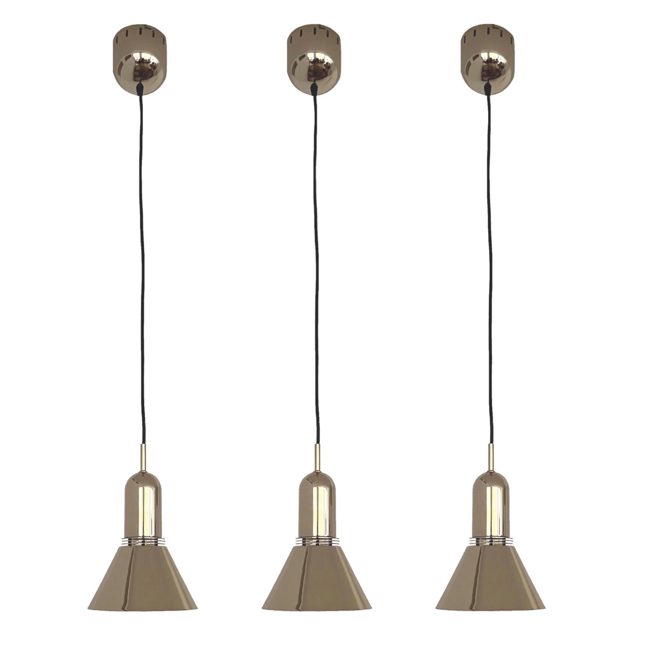 This Set has never been used, perfect condition, included original carton box. This Marvelous Mid-Century Set is composed by:
- Three of Gold Long Chandeliers by Estiluz. Model: T-1142. Dimension:
H 155 cm x D 18 cm (H 61.02 in. x D 9.45 in.).
- Two