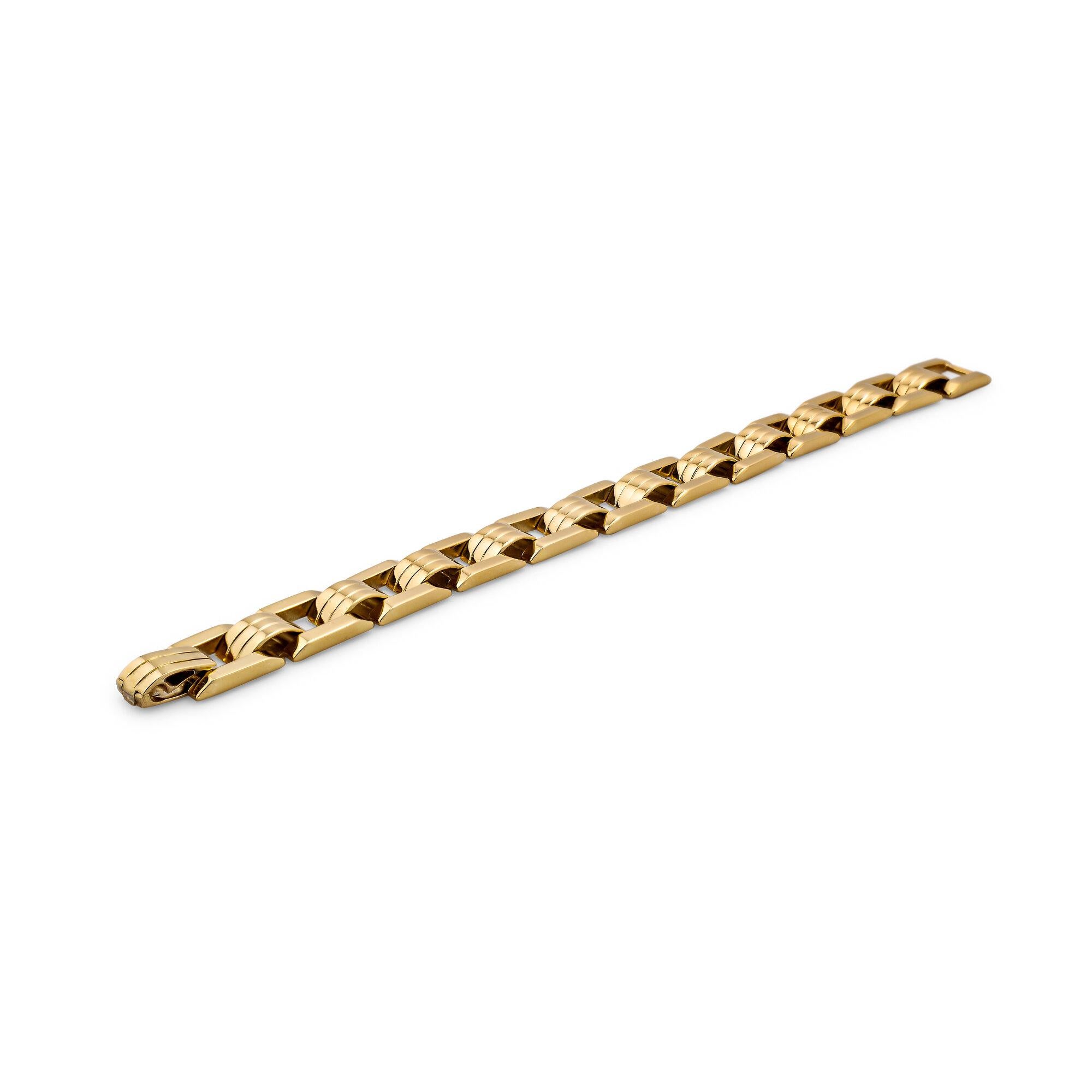 This mid-century, circa 1935-40, small link gold track bracelet looks as if it was created today using American railway tracks as the design inspiration.  With a series of square train track links, alternating with ridged half dome connectors, this