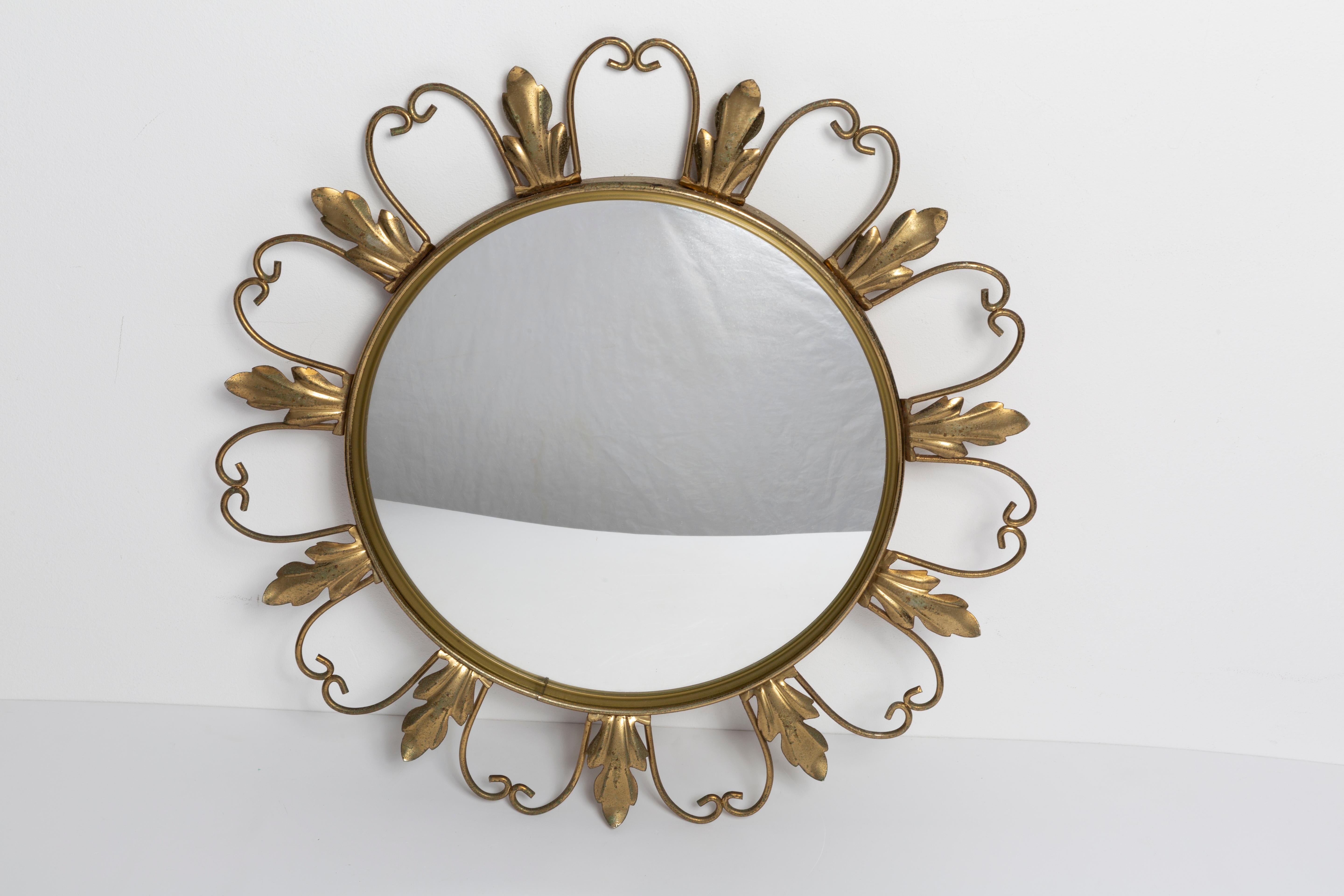 shaped gold sunburst mirror