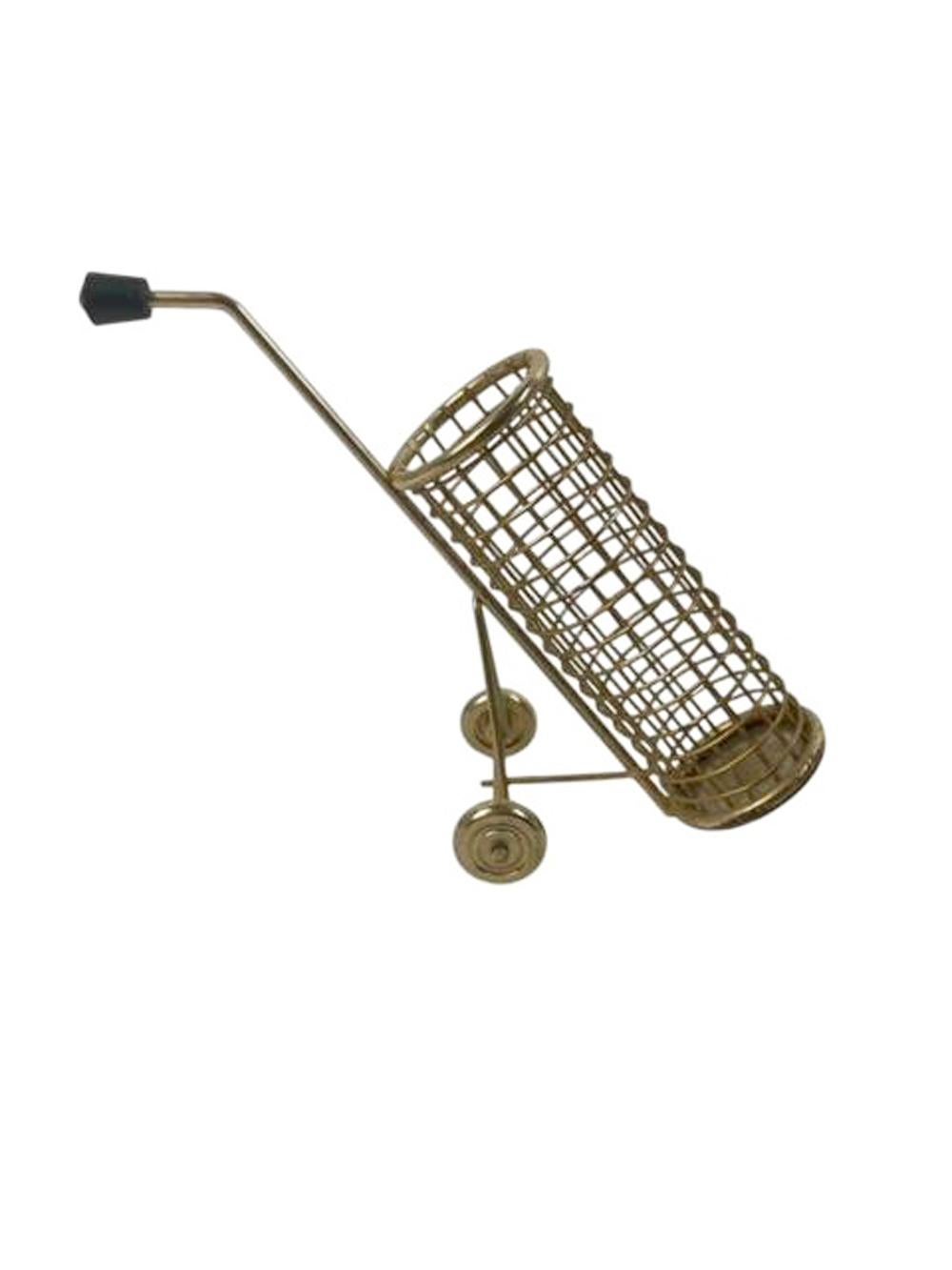 Set of six gold-tone metal golf club form swizzle sticks / muddlers in a gold toned wire mesh golf bag with wheels.