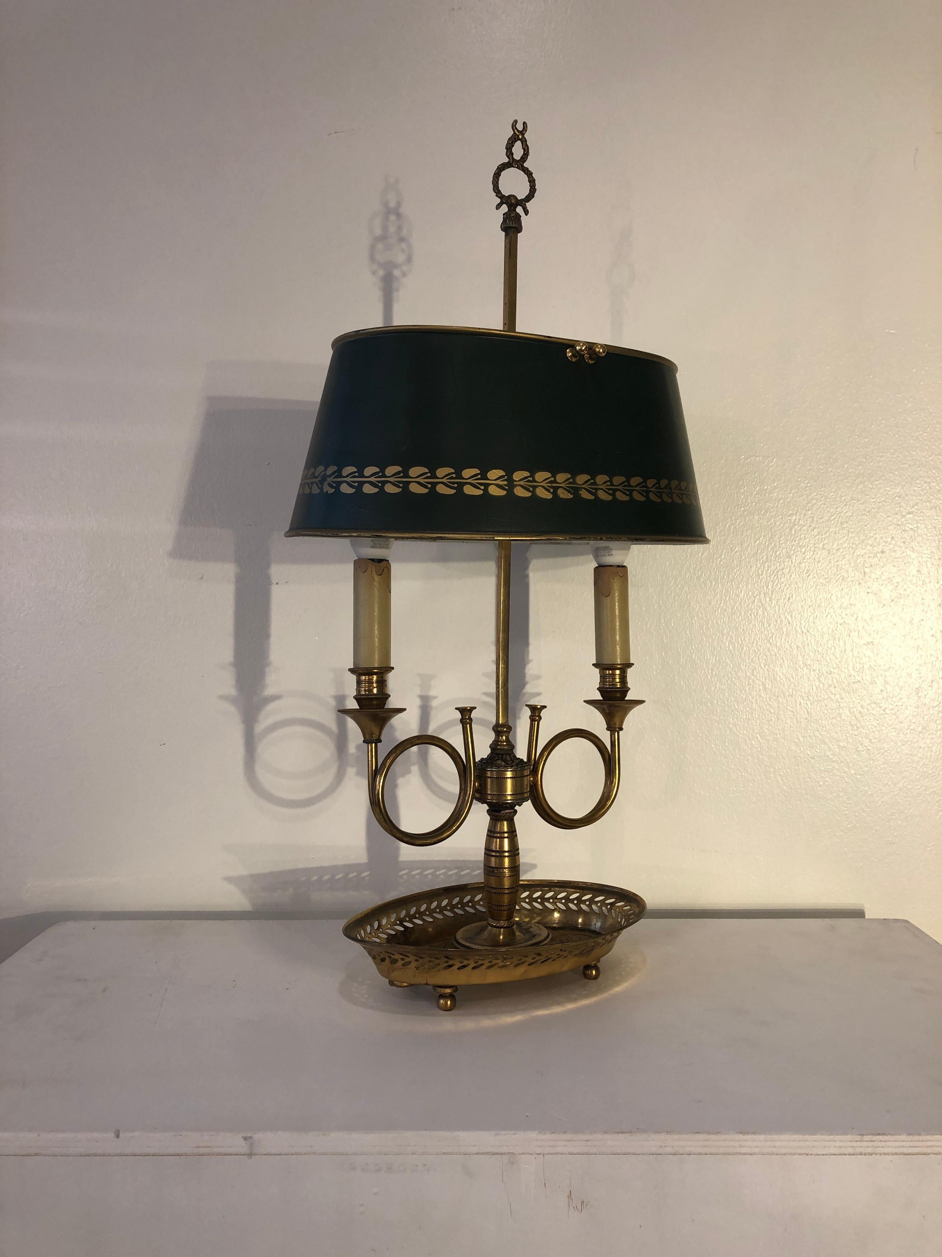 Mid century golden bronze and metal dark green lamp-shade Bouillotte lamp. From France from 1940s period on the sale of antique lamps.
Oval tray - brass - base, two lights holder, adjustable in height green base and golden decor lampshade.
Very