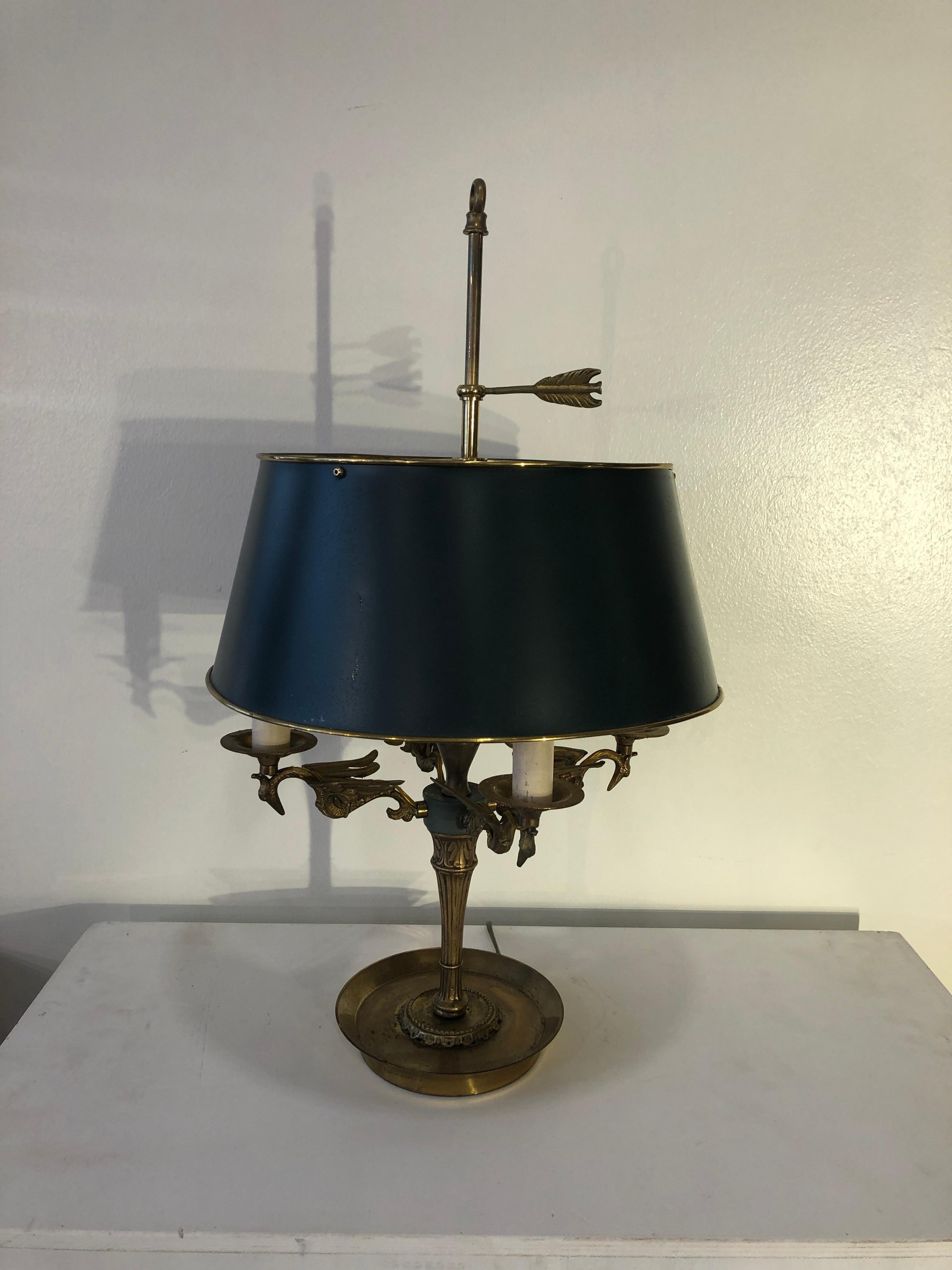 Mid century golden bronze and metal dark green rounded lamp-shade Bouillotte lamp. From France from 1940s period on the style of antique Empire lamps. Rounded - brass - base, four swans shaped lights holder, adjustable in height, dark green