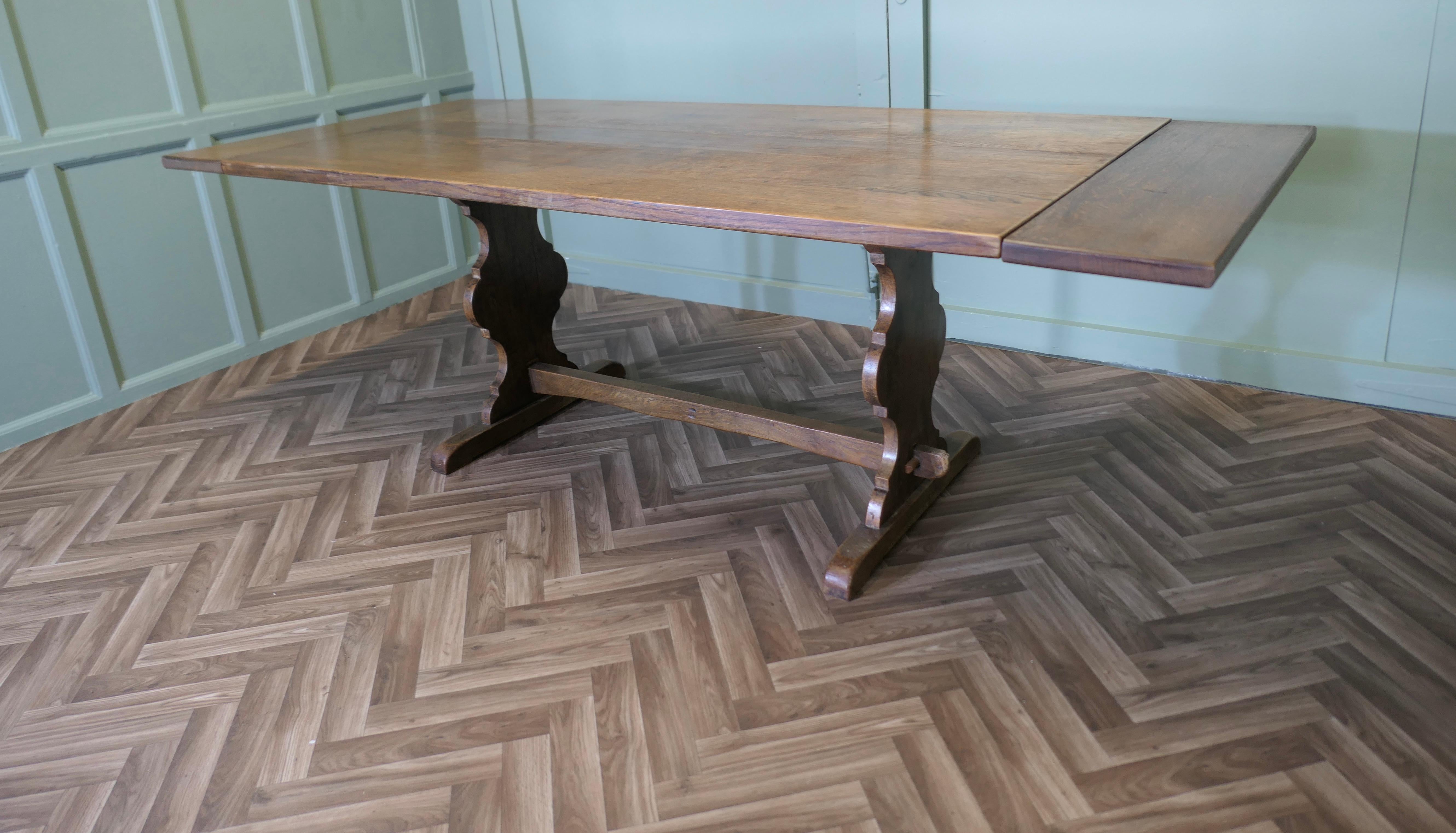 Mid Century Golden Oak Extending Refectory Table

This is a good Golden Oak Refectory style table, it extends to 89