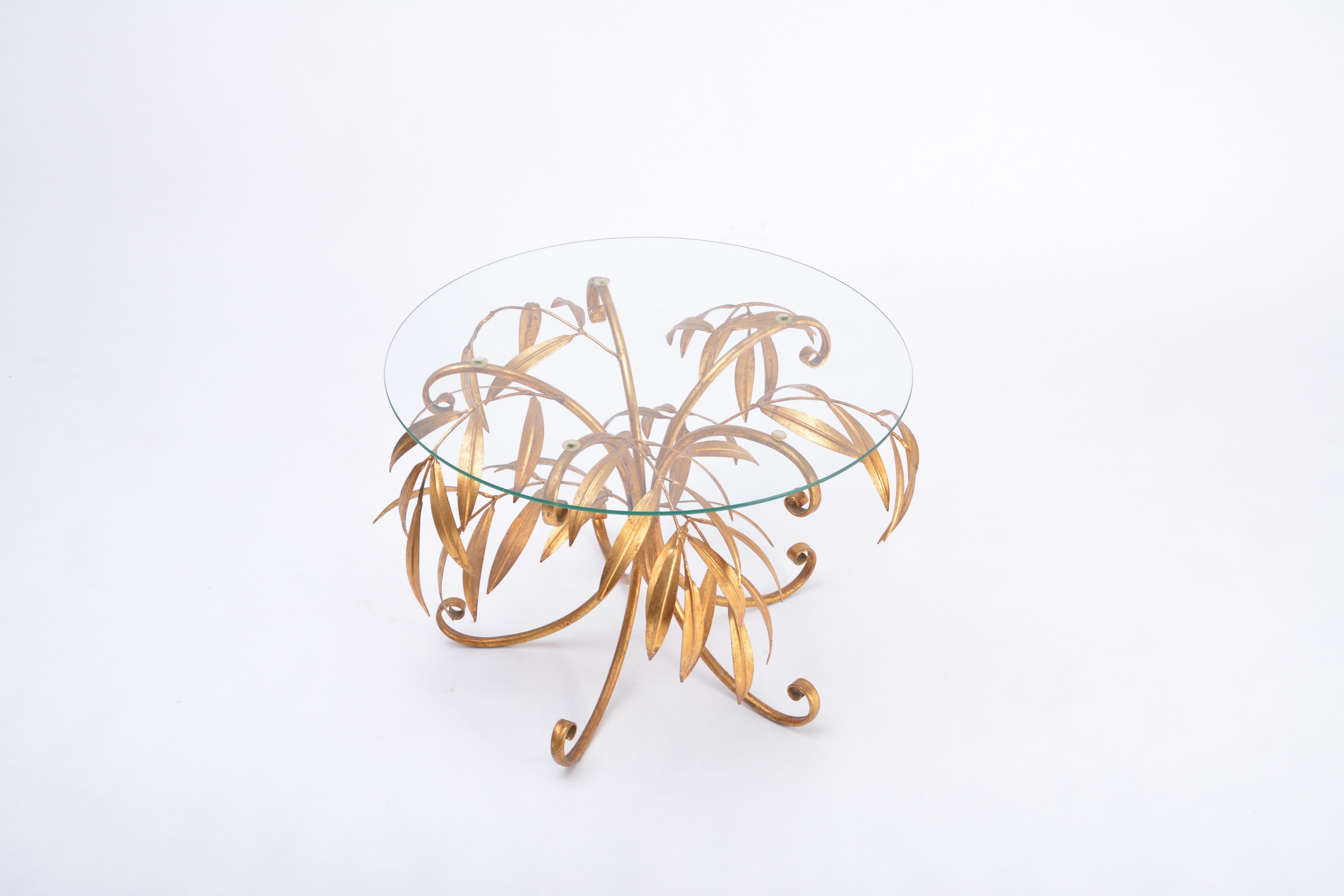 Mid-Century Modern golden palm tree side table by Hans Kögl

Side table produced in Italy in the 1970s for Hans Koegl. Structure handmade of gold-plated metal in form of palm tree leaves, circular top made of glass.